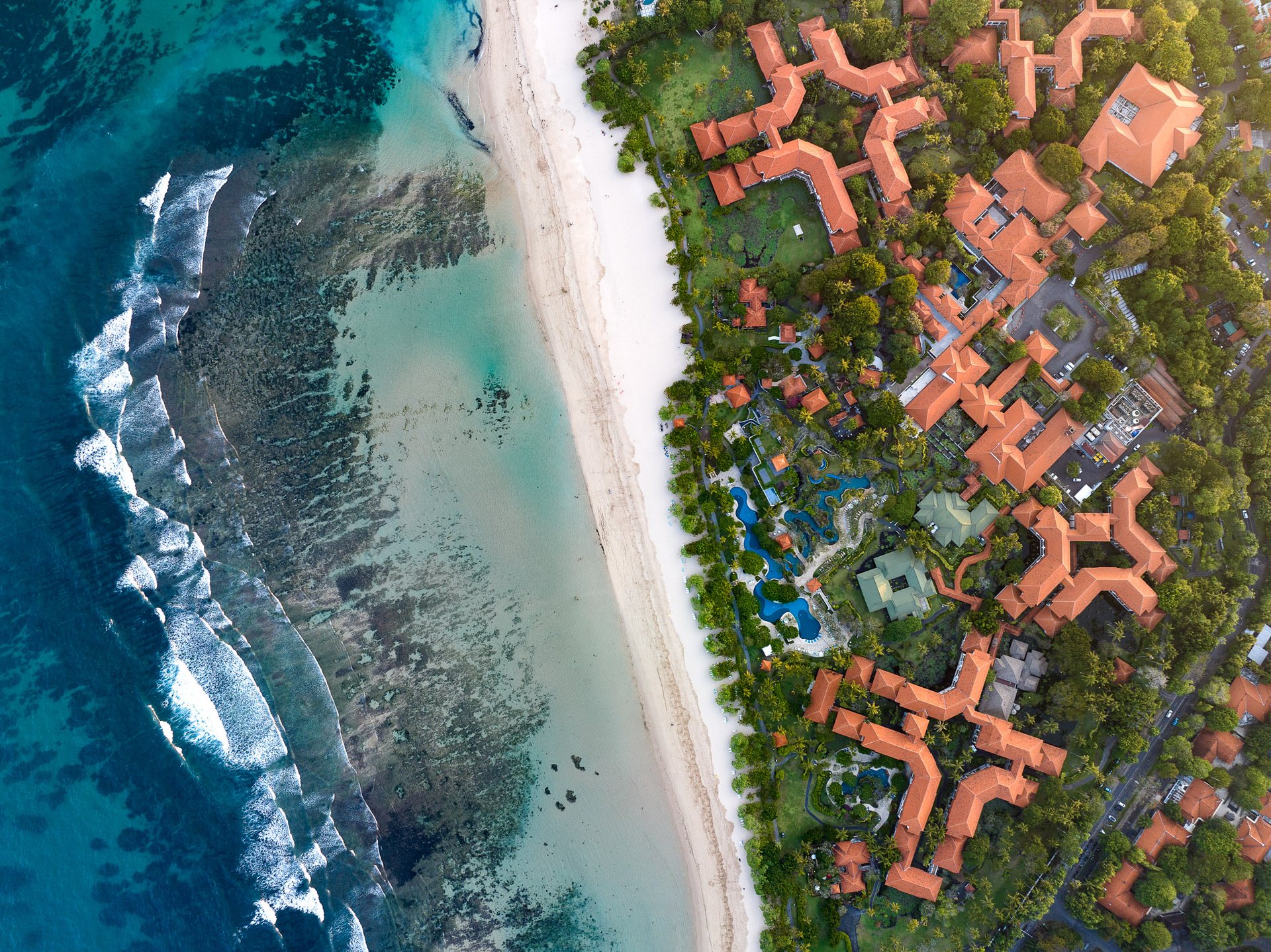 Luxury hotels inside a huge gated community in Nusa Dua, which controls access to the beach and the surrounding amenities.