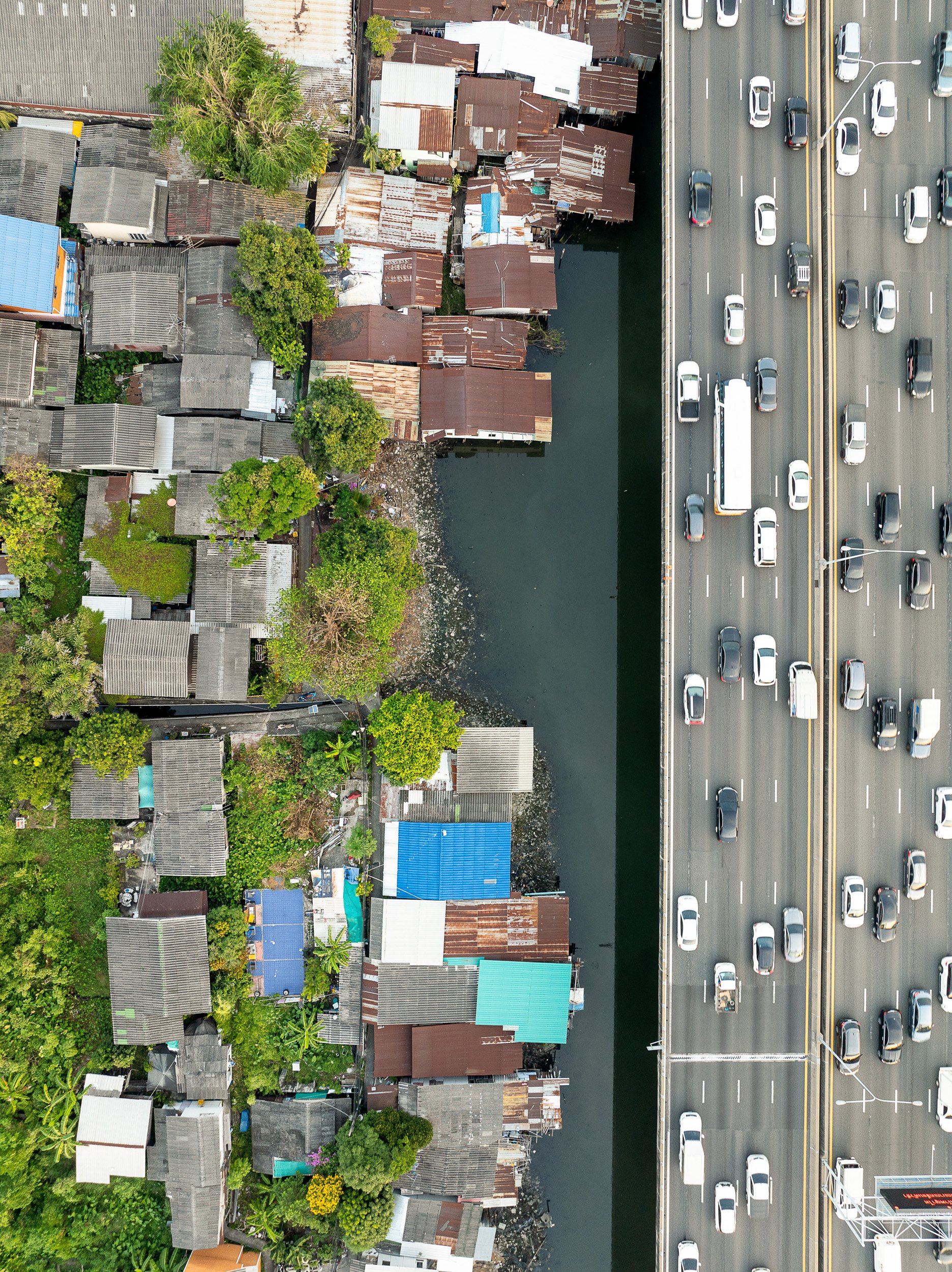 The Sirat Expressway flies over poor neighborhoods, built over a fetid canal in Bangkok's center.