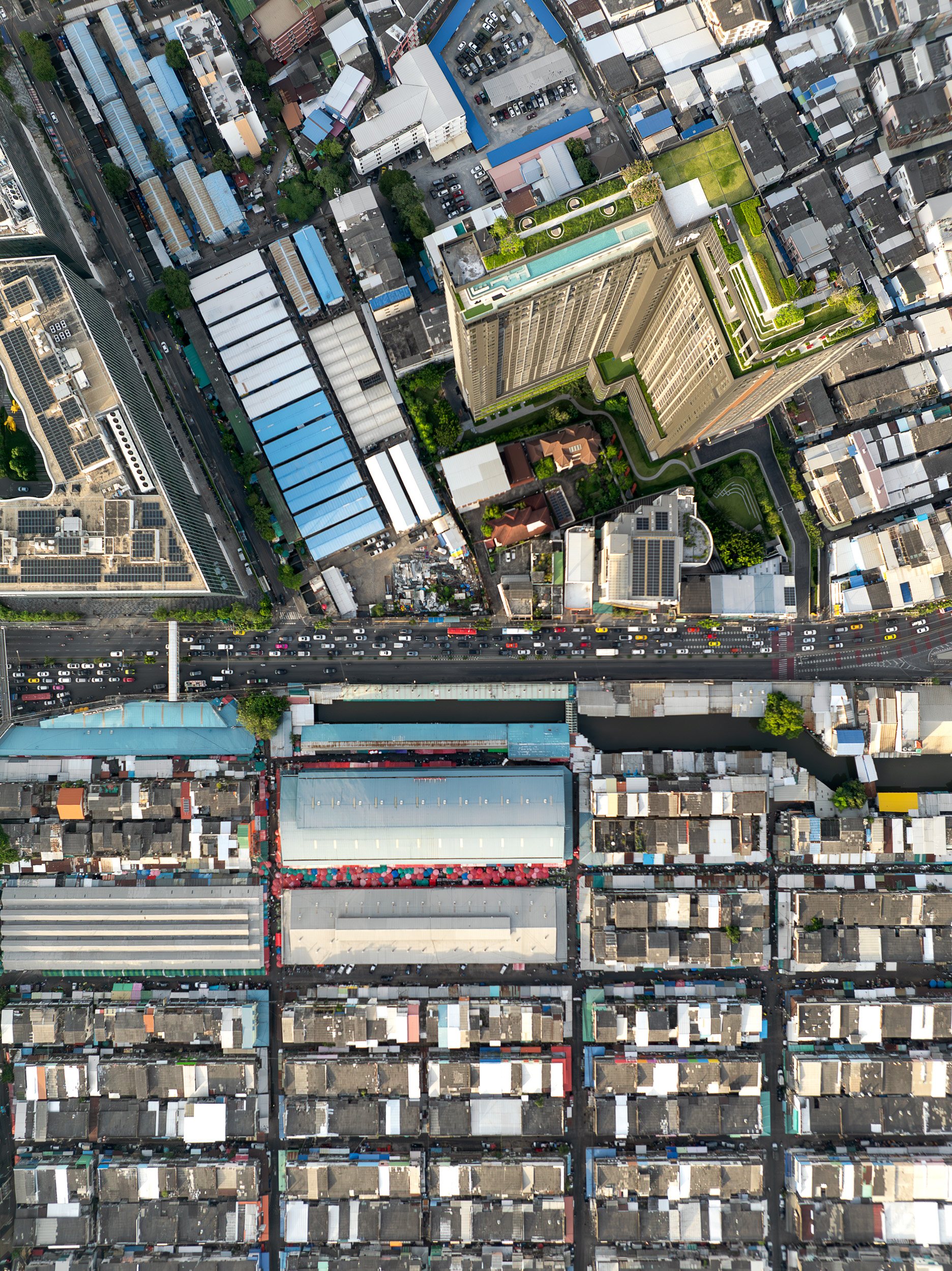 New upscale apartments overlook the Khlong Toei market.