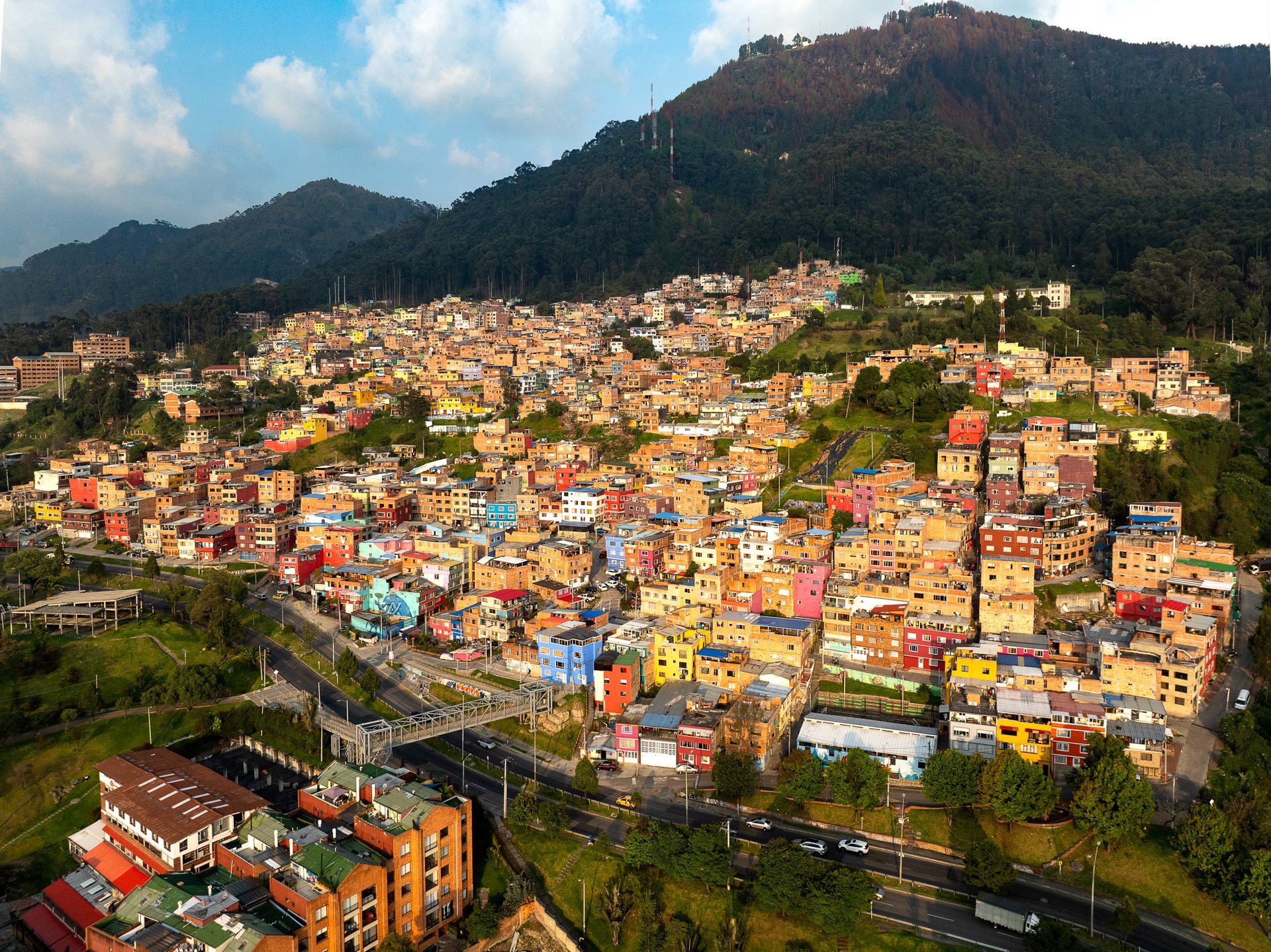 Poor neighborhoods classified as "2 or 3" on the social strata map sit high above the Chapinero neighborhood, one of the city's nicest.