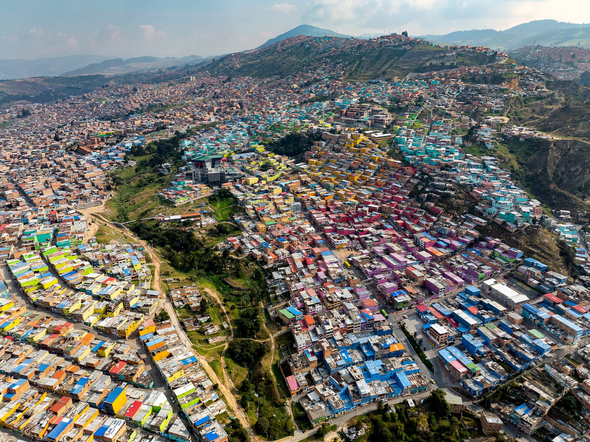 Colourful houses climb the mountainside in Ciudad Bolívar, on Bogotá's southern edge, the locality that holds the city's largest