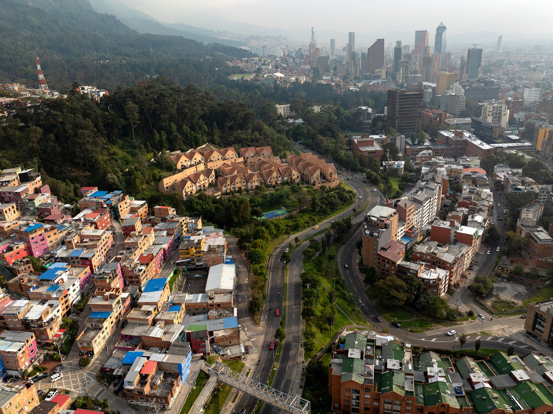 Downtown Bogotá in the setting sun, with the barrio of Villa del Cerro and the rich neighborhood of Chapinero in the foreground.