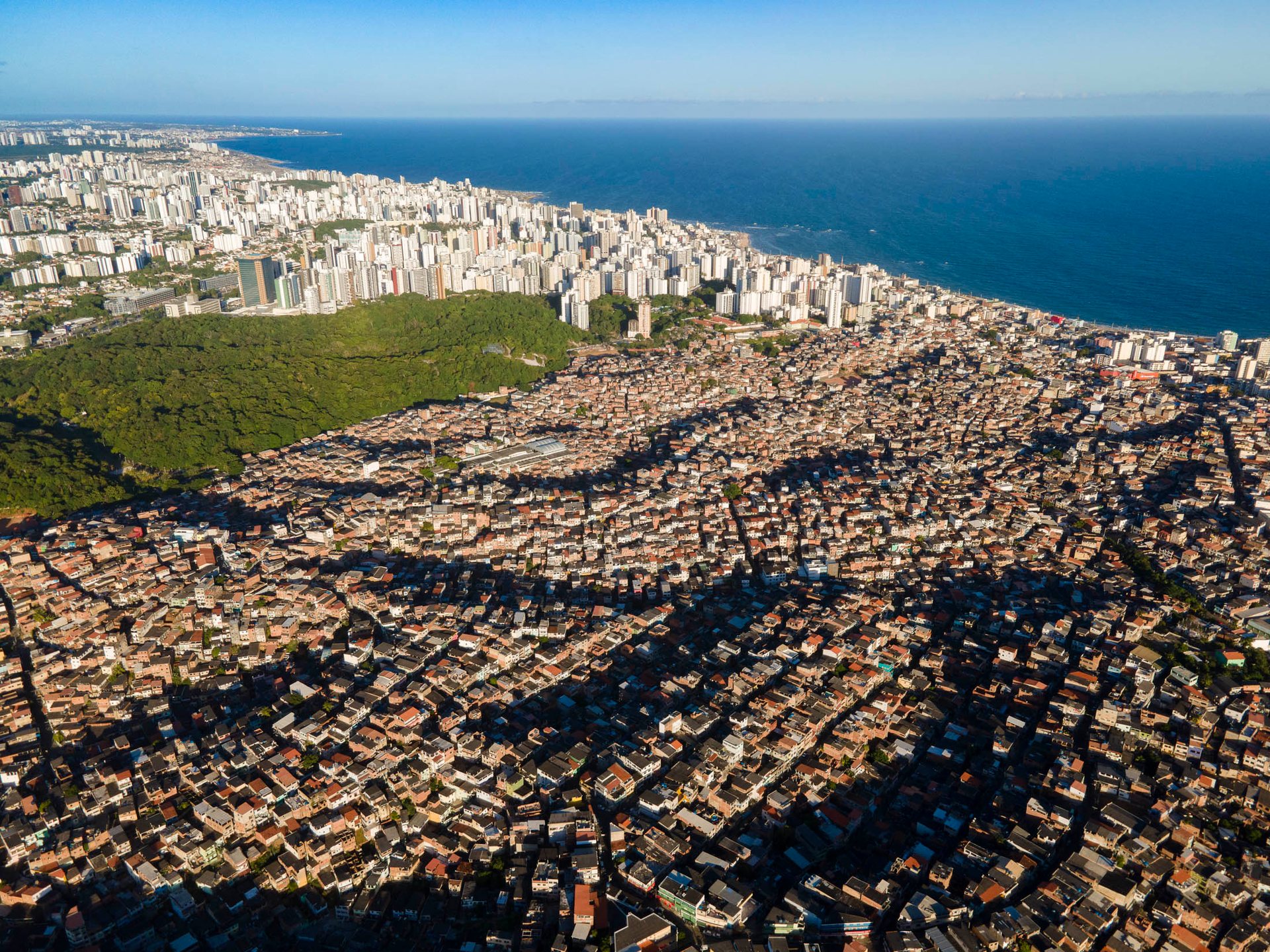 densely packed informal housing next to high-rises in Salvador.