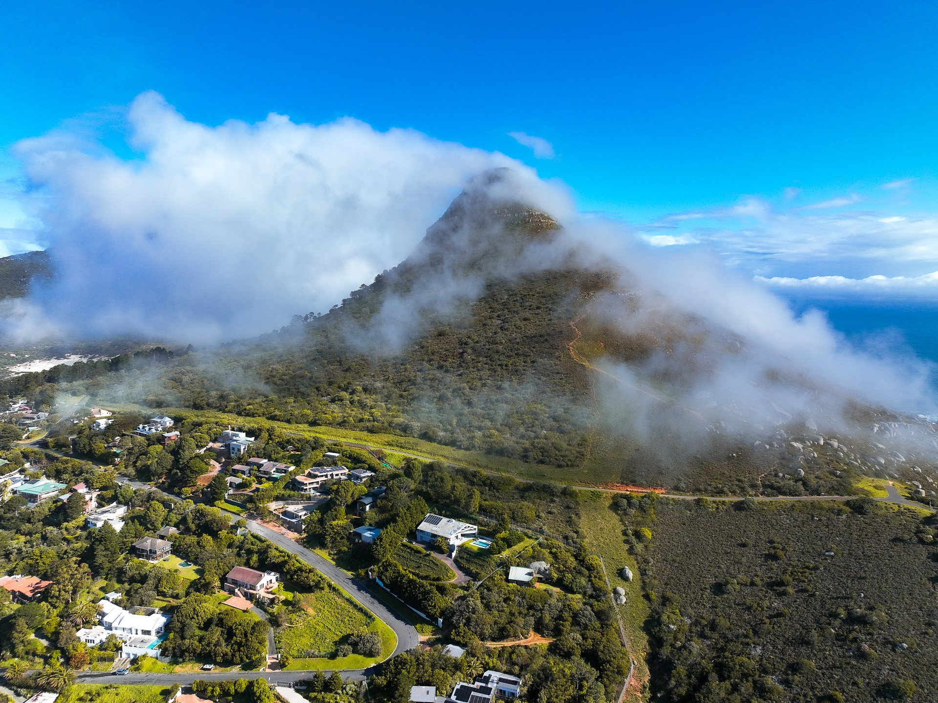 Little Lion's Head, as a strong westerly wind blows in off the cold Atlantic Ocean.