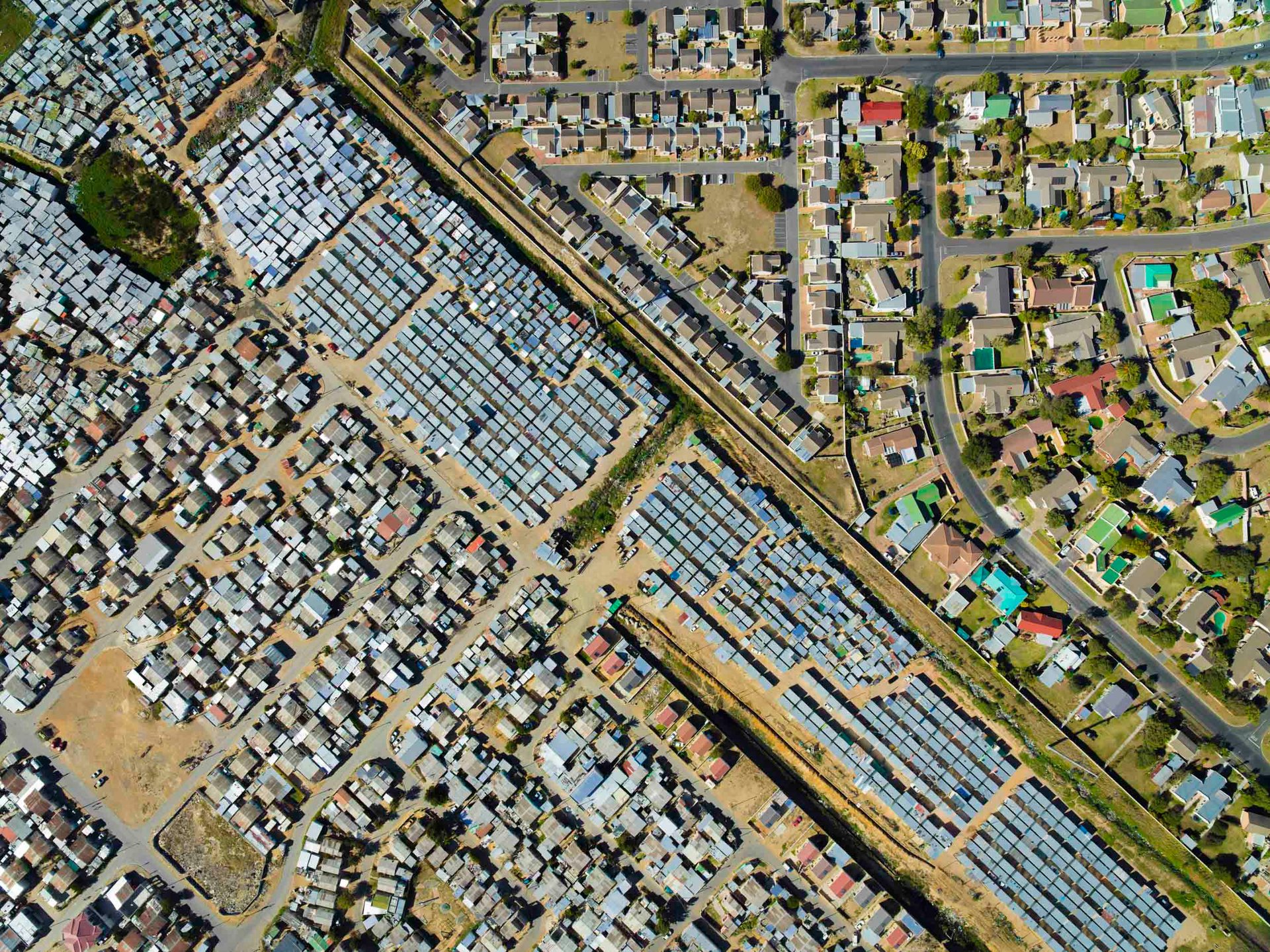 A checkerboard pattern of inequality near Somerset West, with the former "black spot" of Nomzamo and several informal areas visible, about