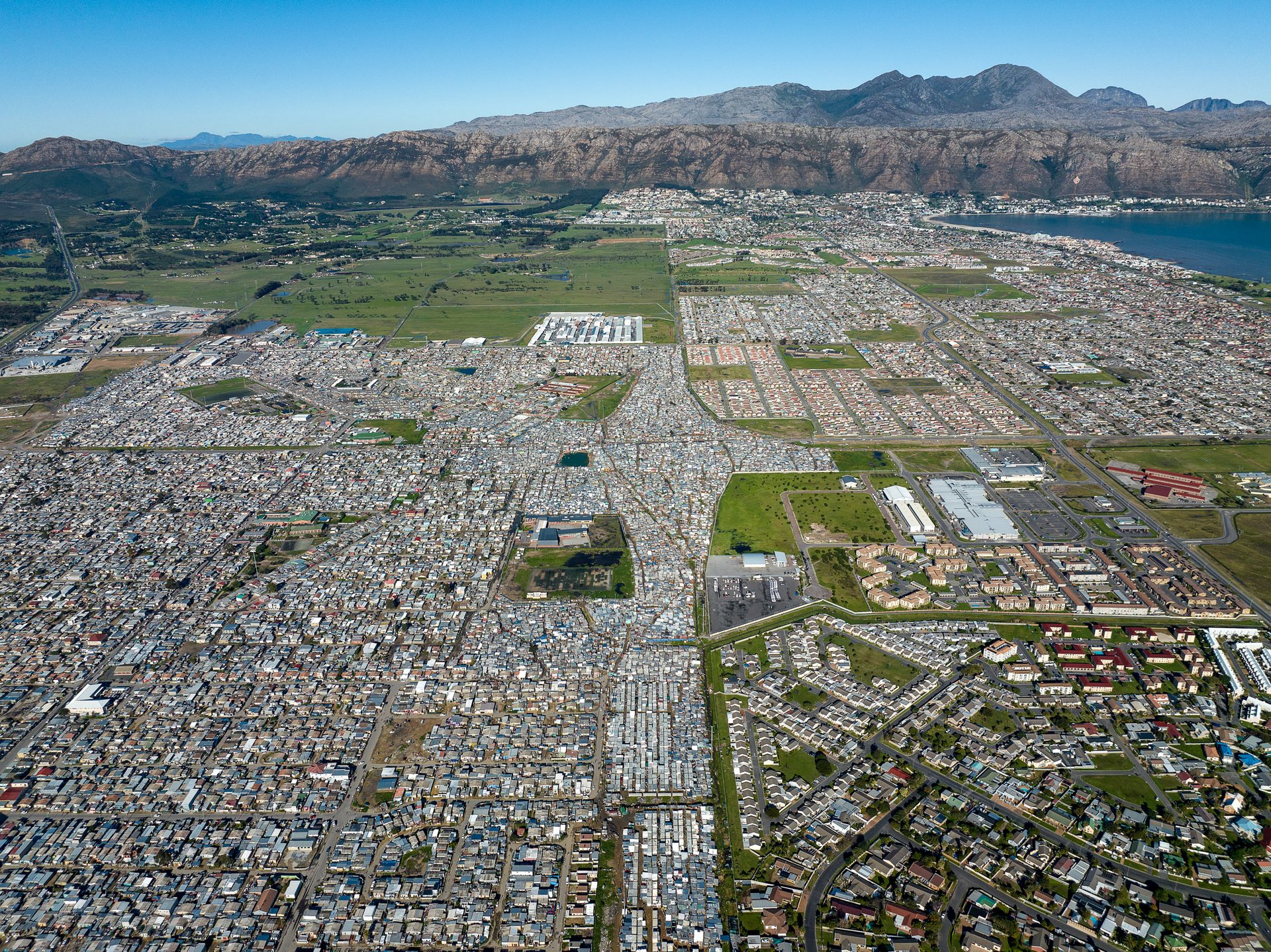 A checkerboard pattern of inequality near Somerset West, with the former "black spot" of Nomzamo and several informal areas visible, about