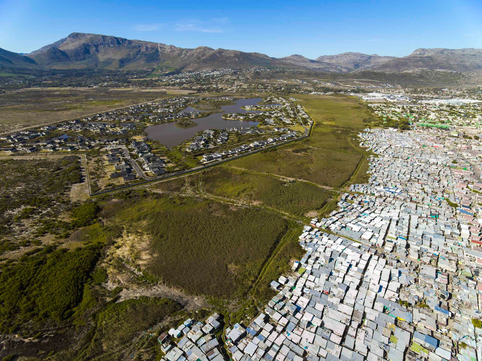 In a stunning display of contrast, Kayamandi sits at the top of a hill overlooking one of the most beautiful winelands in the world, those