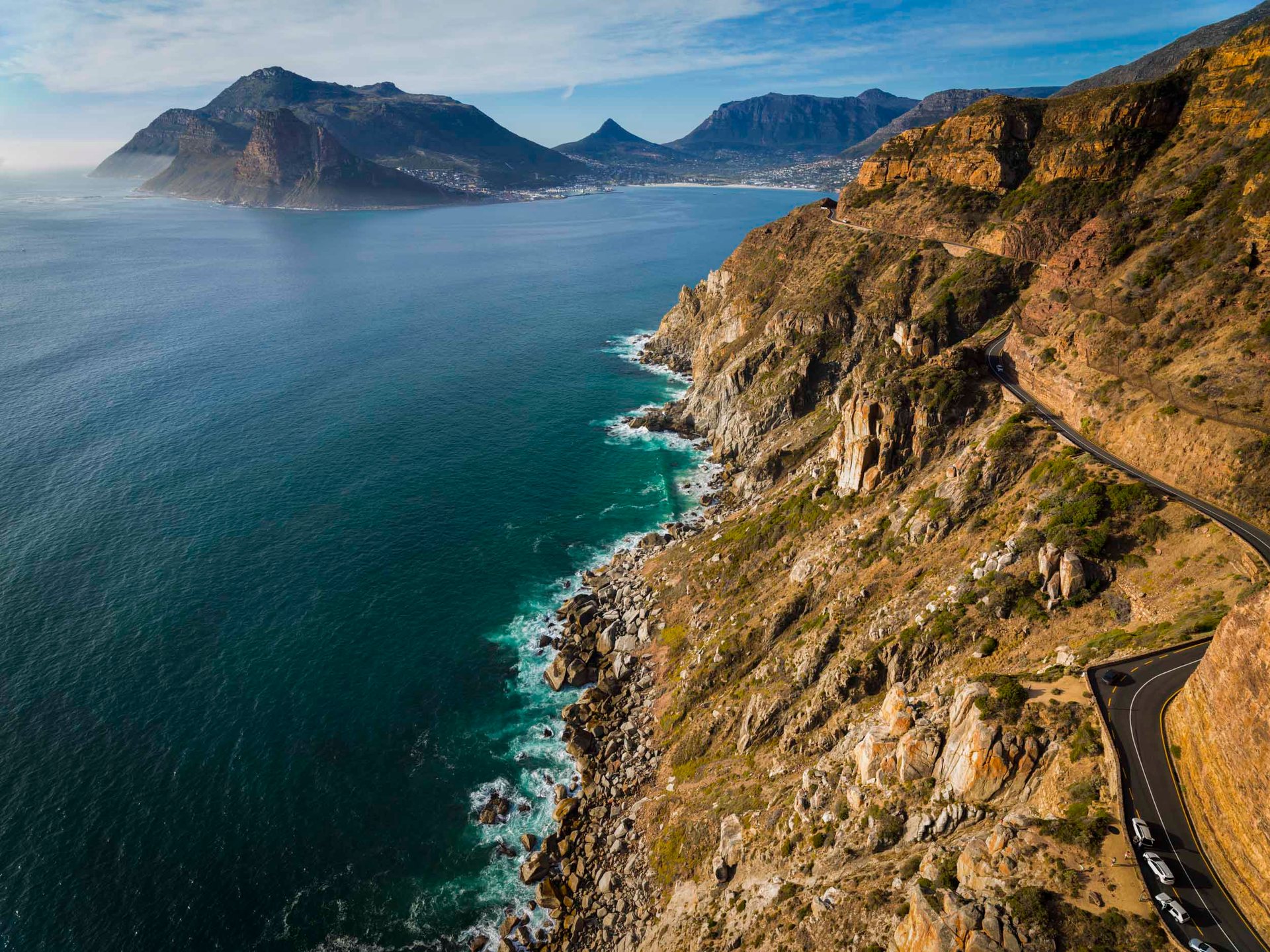 The world famous Chapman's Peak drive, winding towards Hout Bay in the distance.