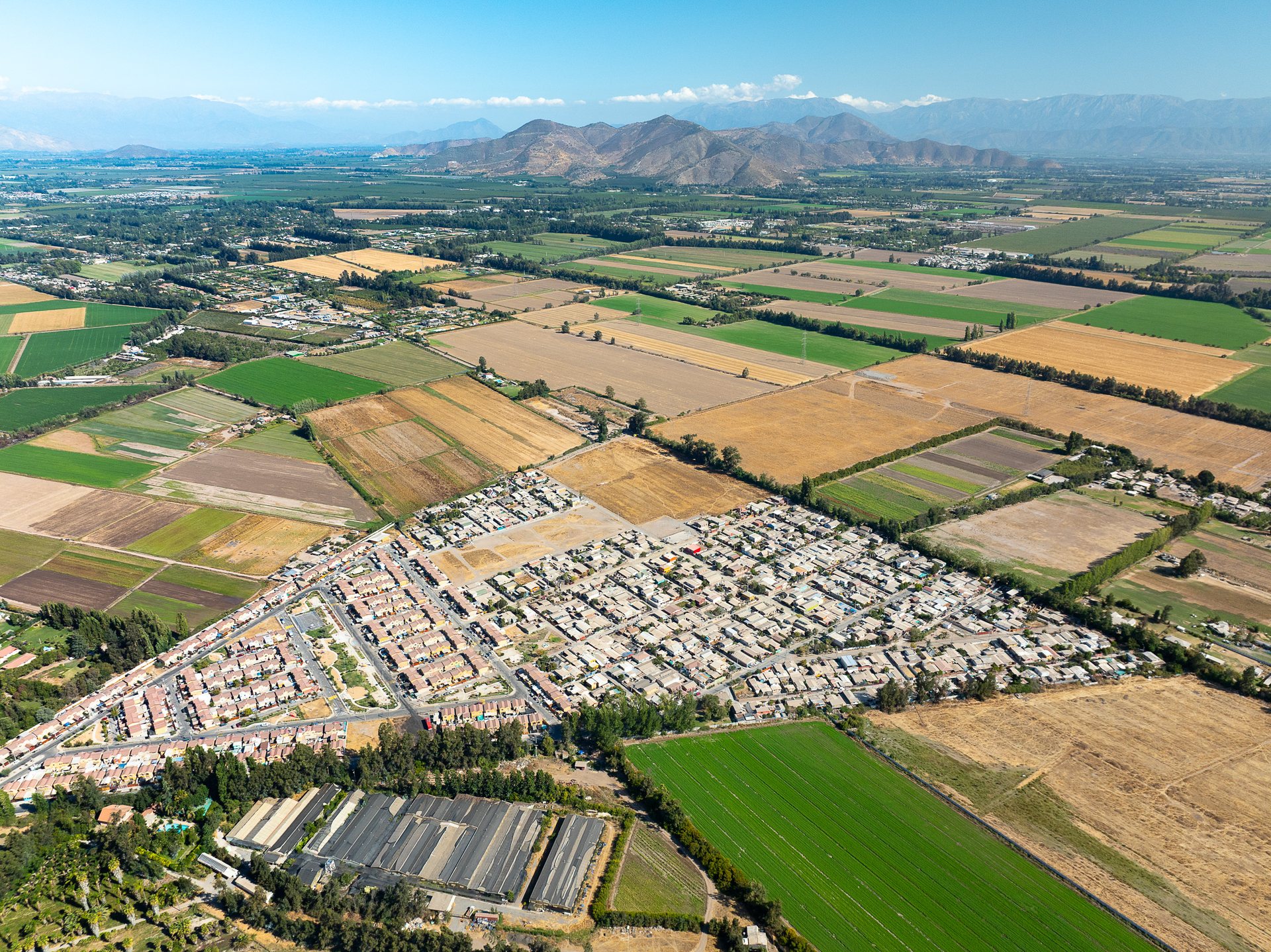 The lush and productive farmland of the valley in which Santiago sits is steadily being cleared for neighborhoods like this one in the