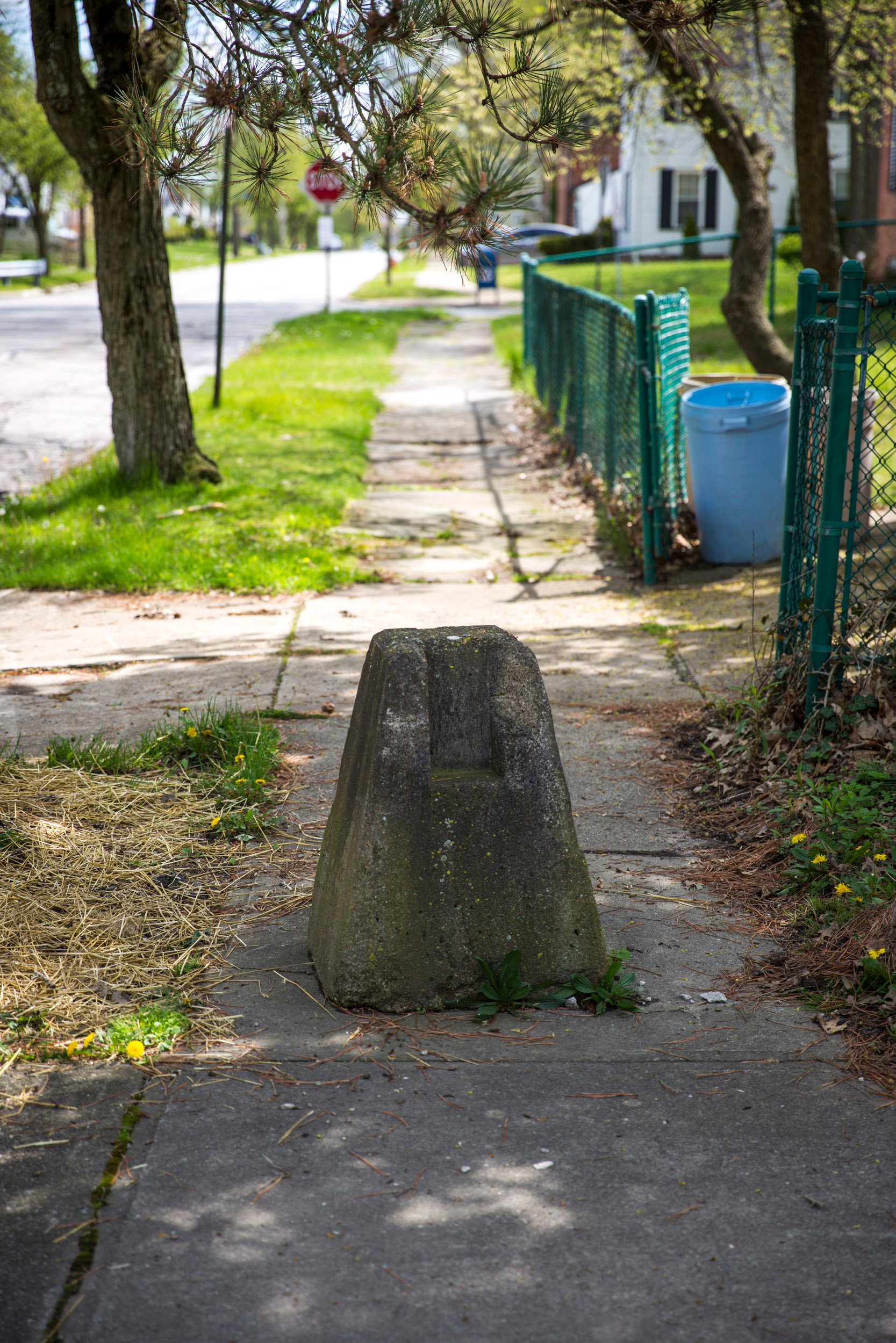 Concrete bollards still exist between the two communities, even on the sidewalk.