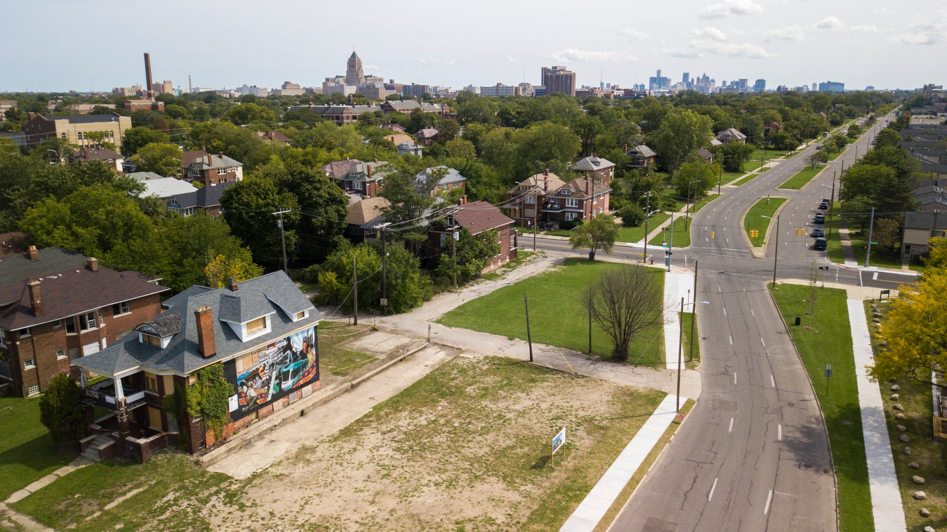 A colorful mural stands at the site of the 1967 Detroit riot, alongside a road now known as Rosa Parks boulevard.