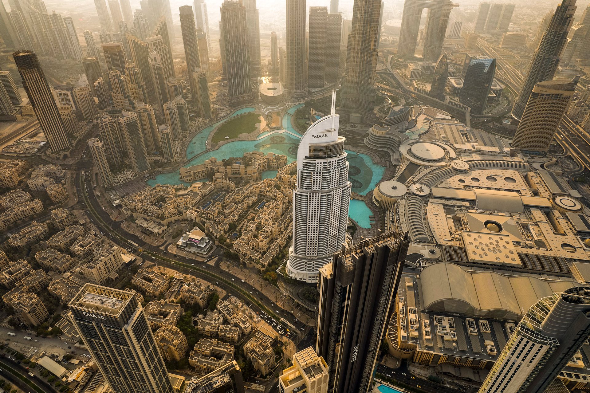 Buildings tower over the centre of Dubai: the Burj Khalifa, the vast Dubai Mall, and an artificial lake with the world's largest fountain.