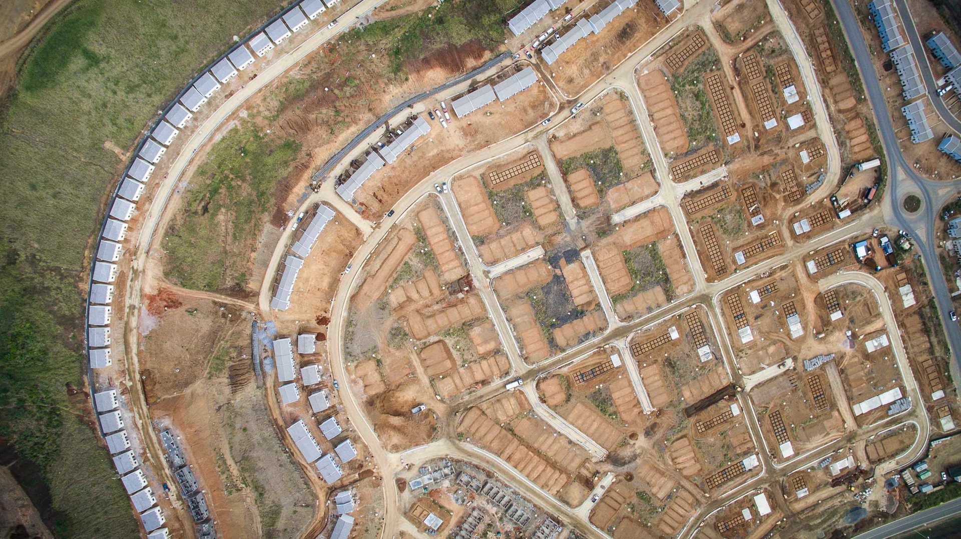 Shacks line the drainages underneath the wealthy suburb of Morningside in Durban, South Africa.