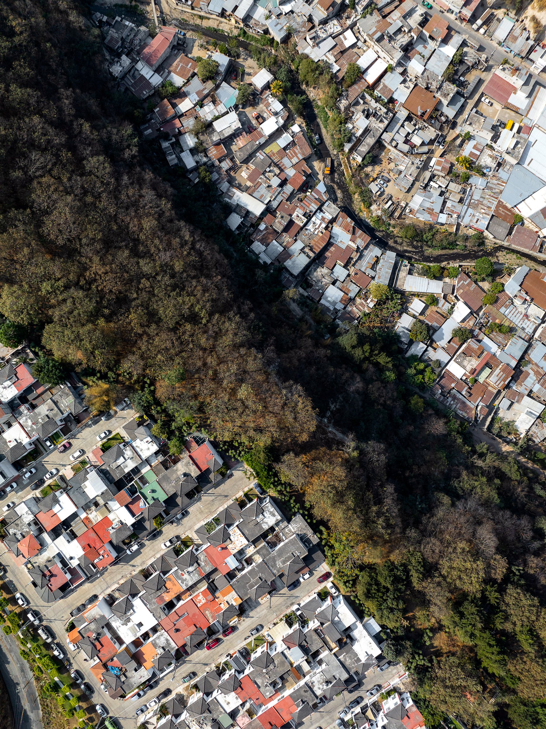 Sometimes communities will be built almost on top of each other - like this one in Villa Nueva, separated by a cliff of 20m.
