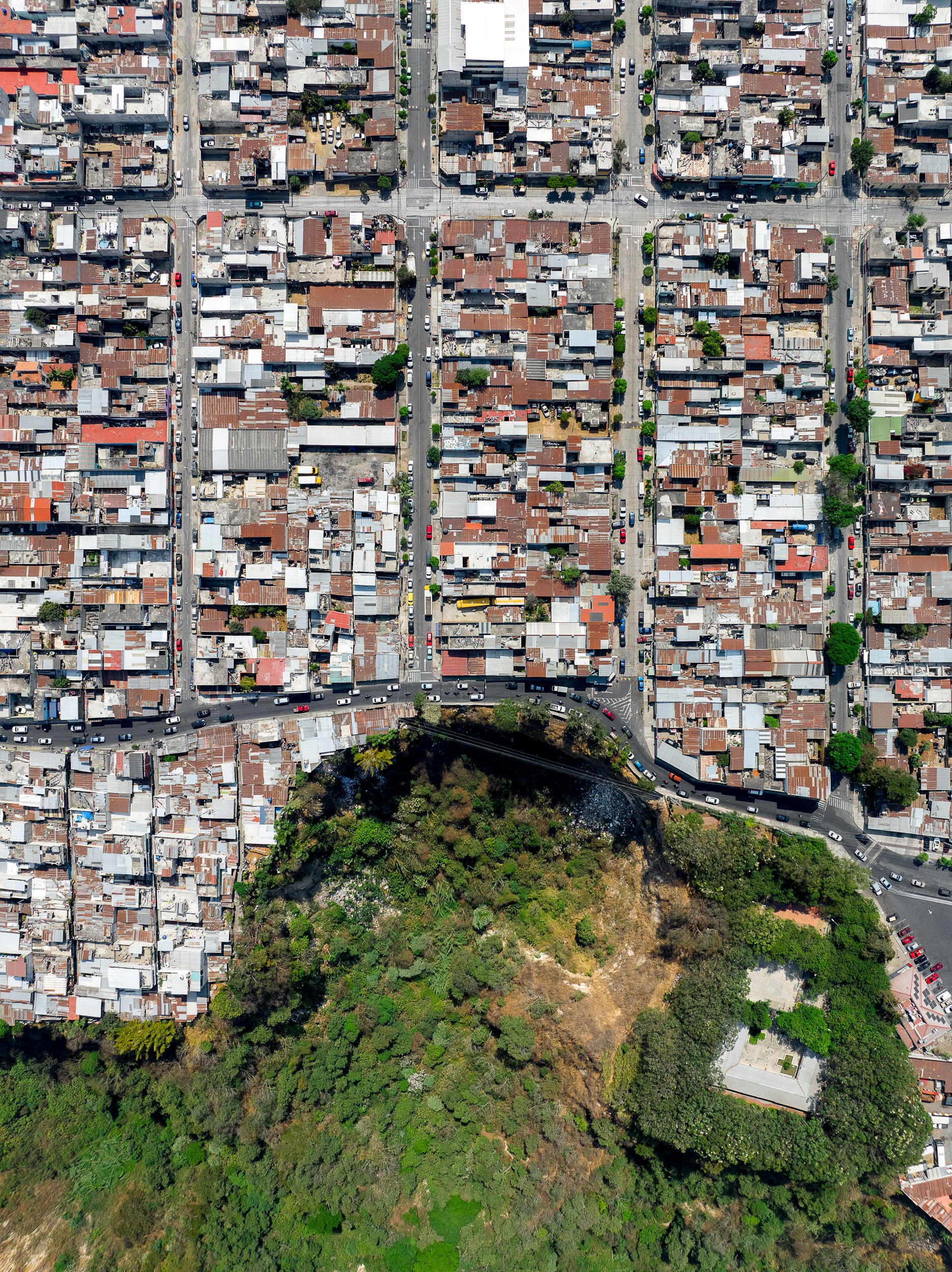 A sinkhole surrounded by the city.
