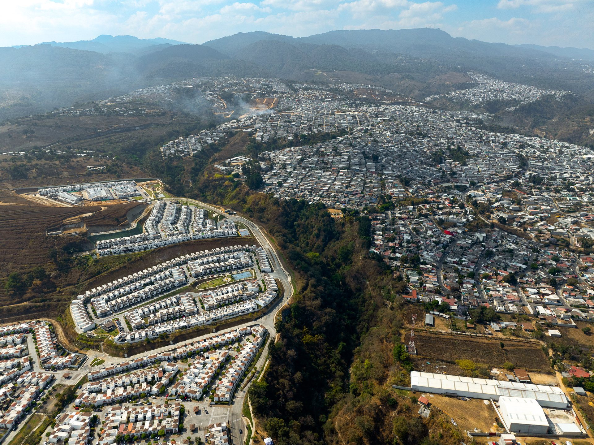 Sprawling development along the volcanic ridges to the west of the city.