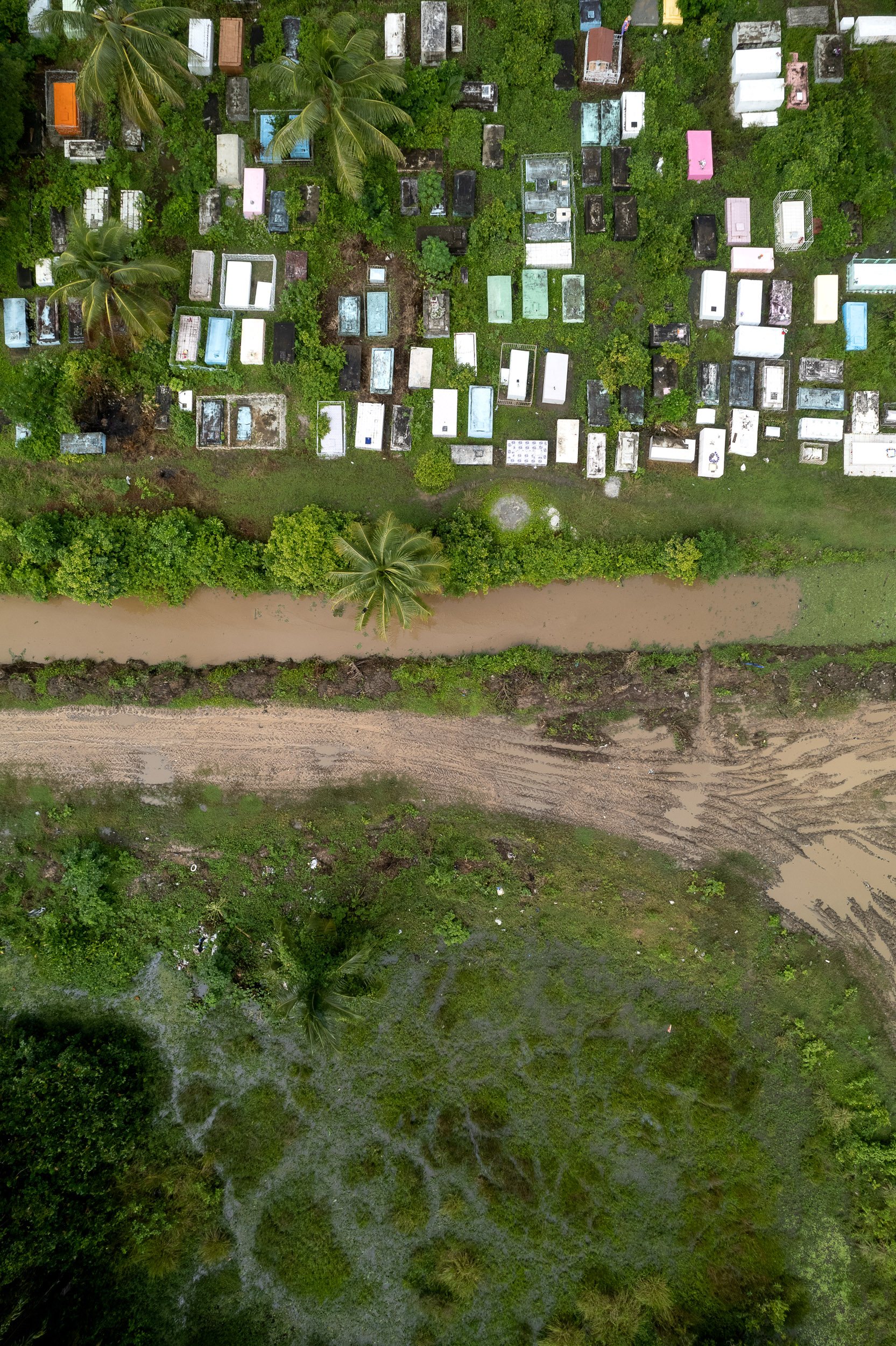 A common cemetery in the fertile land just outside Georgetown, where almost all of the country's population resides.