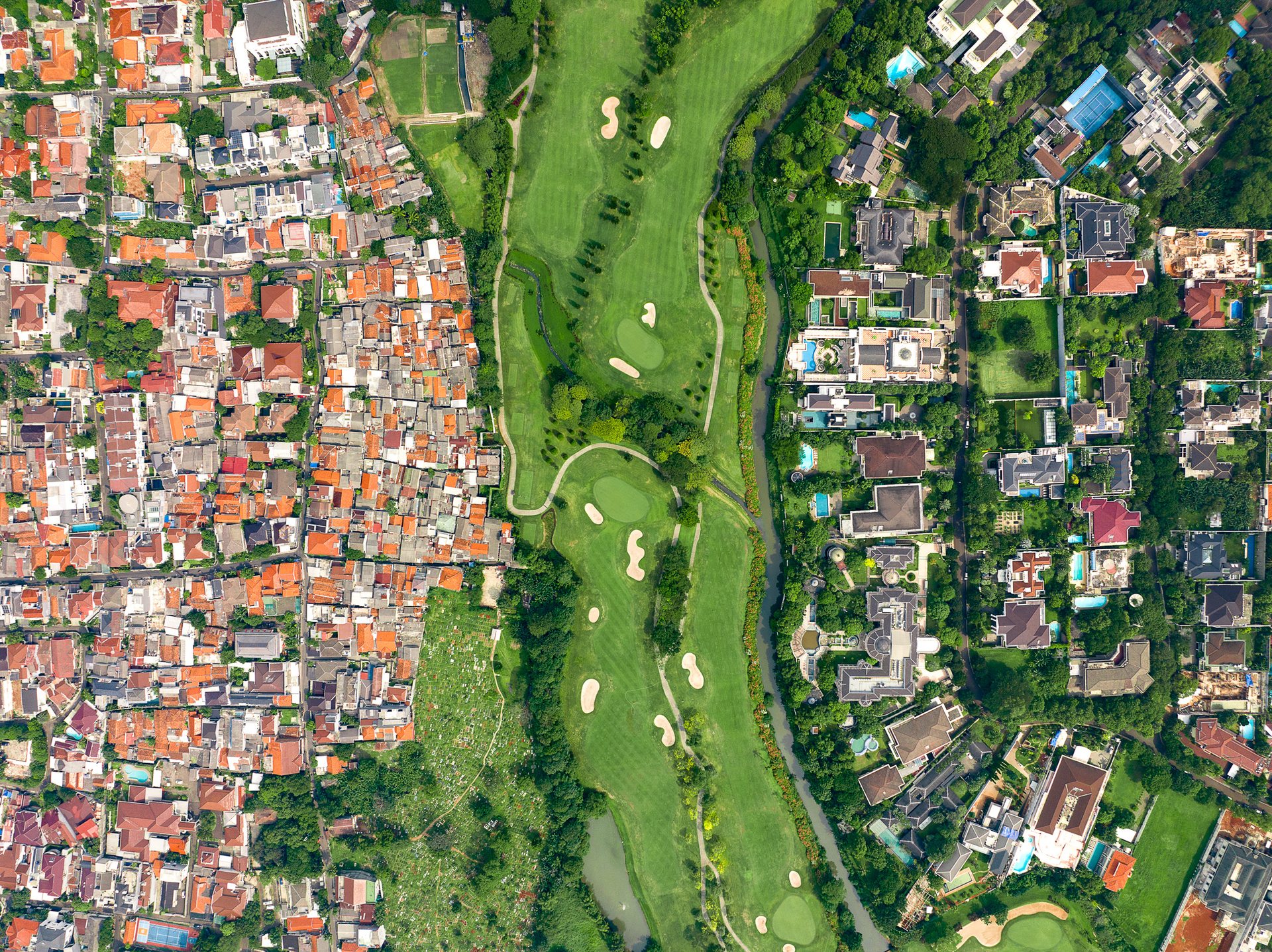Pondok Indah is one of Jakarta's most exclusive neighbourhoods, the city's answer to Beverly Hills, and the Bukit Golf area at its centre is the wealthiest part of it: enormous houses on large plots wrapped around a private golf course, home to conglomerates, officials and expatriates.