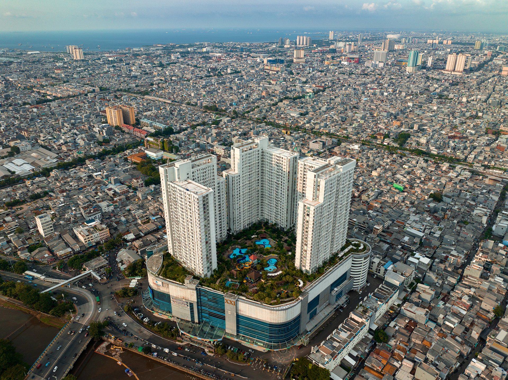 Shopping malls like Seasons City in North Jakarta stand out like citadels, their gleaming facades, swimming pools and expansive interiors standing in sharp contrast to the densely packed, informally built settlements or "kampungs" that are also a defining feature of Jakarta's cityscape.