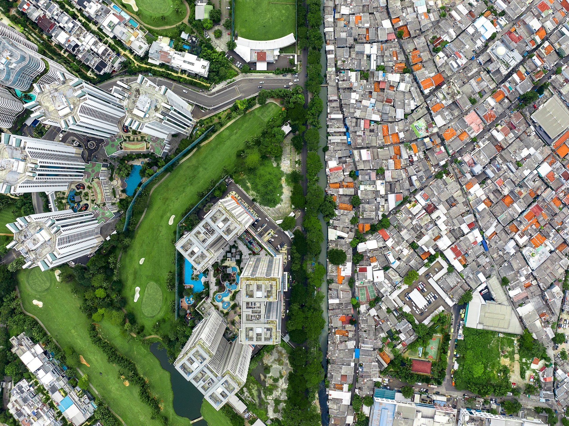 Extreme inequality near Menteng, one of Jakarta's wealthiest neighborhoods.