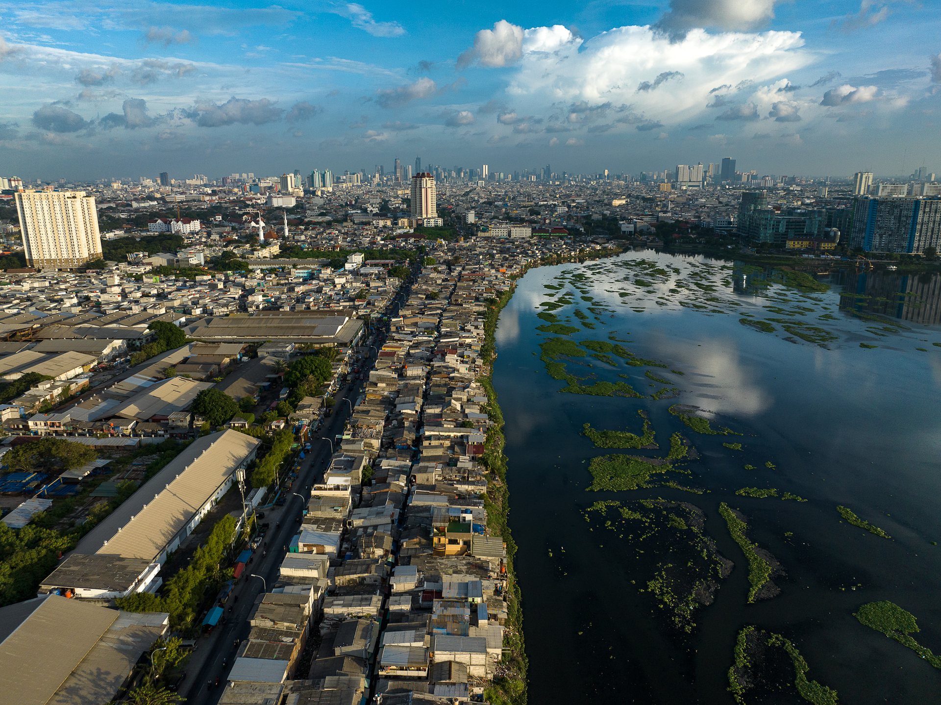 Reclaimed land on Jakarta's northern coast refers to the creation of artificial land by adding large amounts of soil and sand to the existing shoreline, a practice also known as land reclamation.