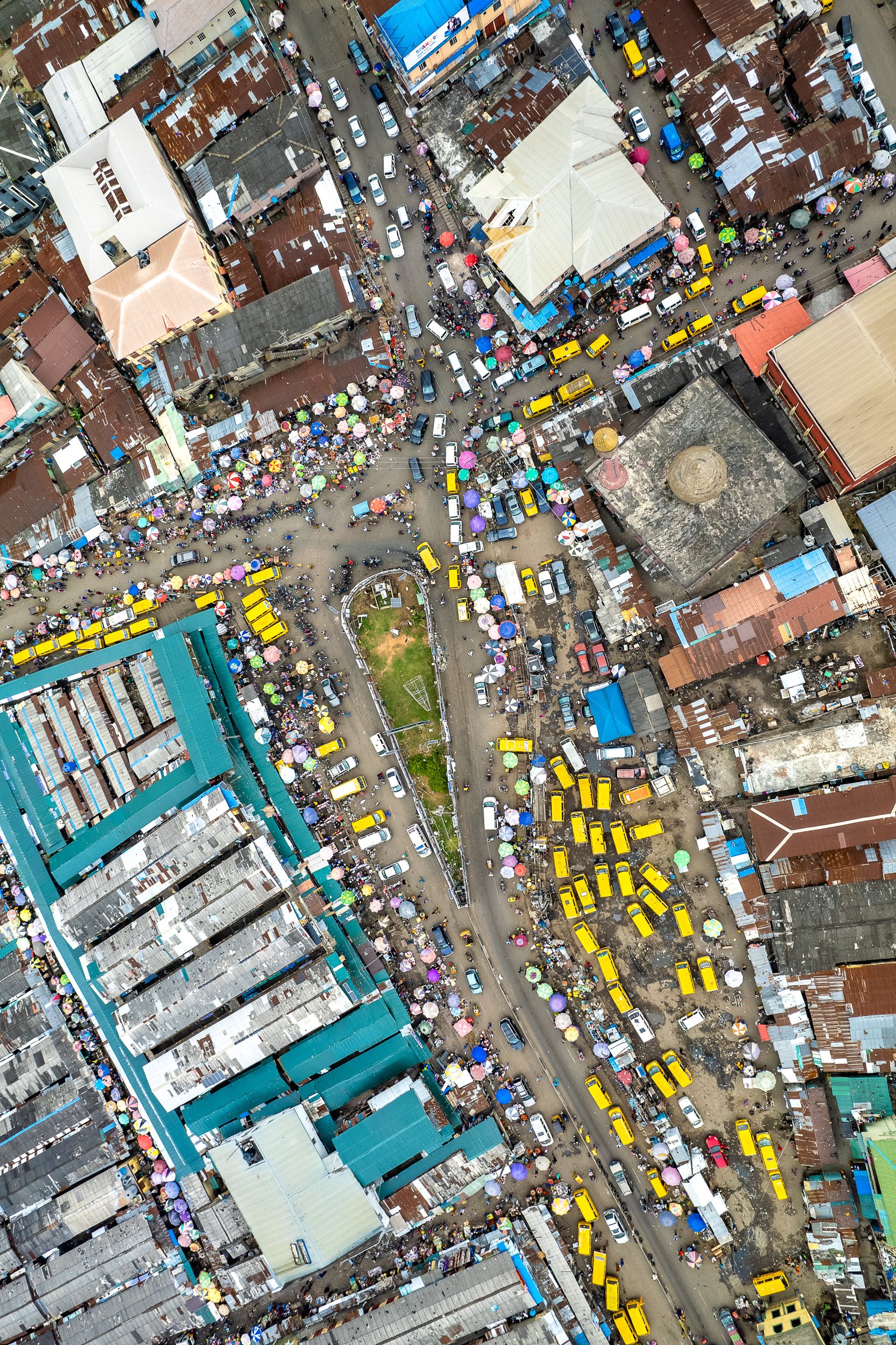A market and communal bus station knot together in Ajegunle, one of the largest and most densely packed slums in Lagos.