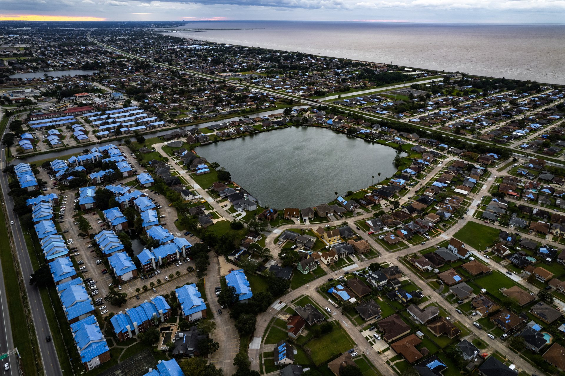 Months after Hurricane Ida ripped through New Orleans with 140mph winds in 2021, most homes still are covered in blue tarps with wind-damaged roofs.
