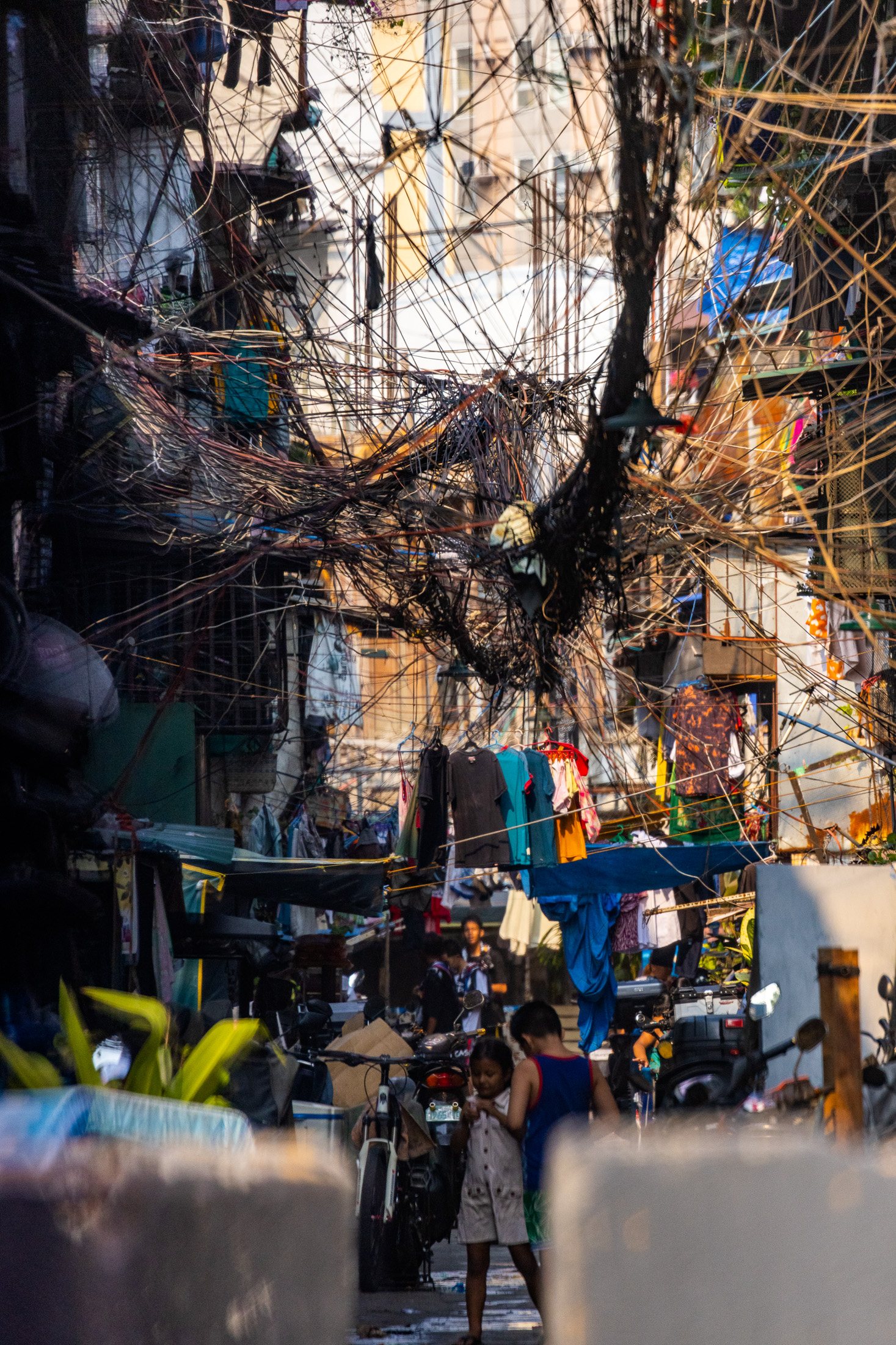 Electrical cables hanging above streets near the Port of Manila that locals call "Spaghetti".