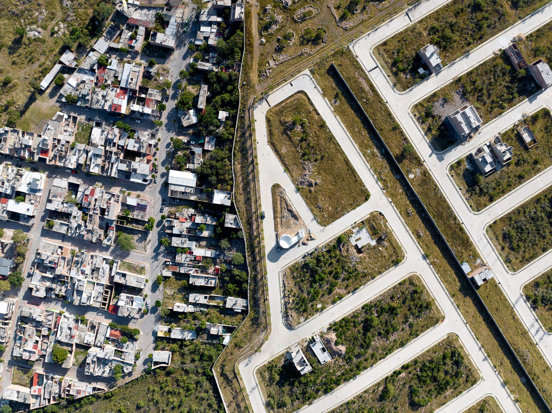 Gated communities in the foothills of León, Mexico are fenced off and slated for development.