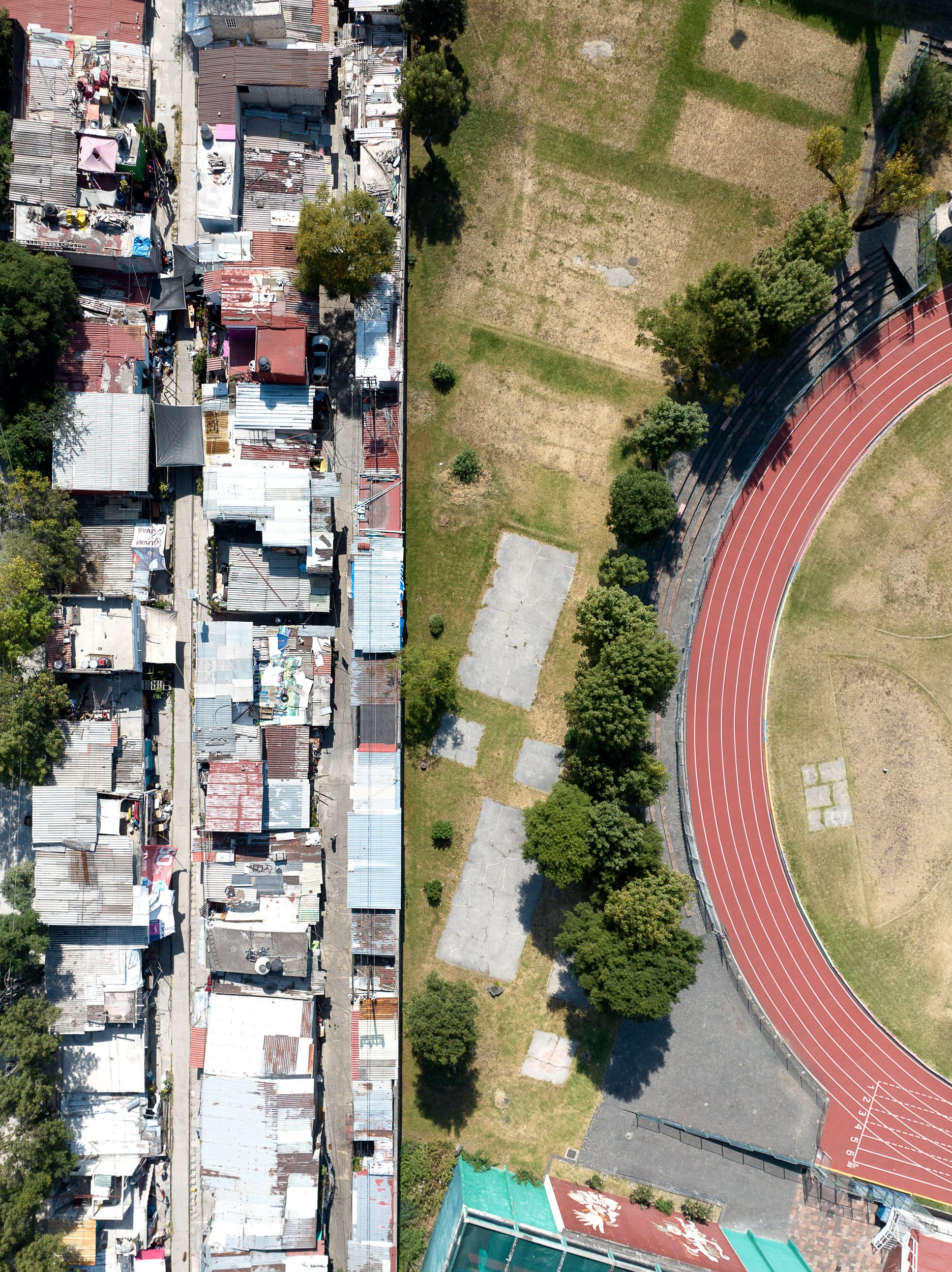 The informal community stretching along the defunct railroad track in Naucalpan, Mexico City, extends for kilometers.