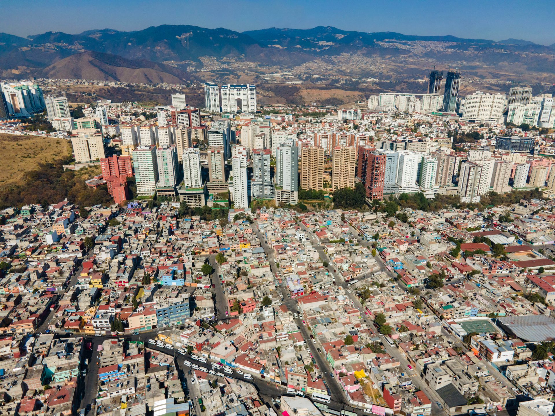 From above, the city grid of Ciudad Nezahualcoyotl (Neza) looks like an endless series of Christian crosses.
