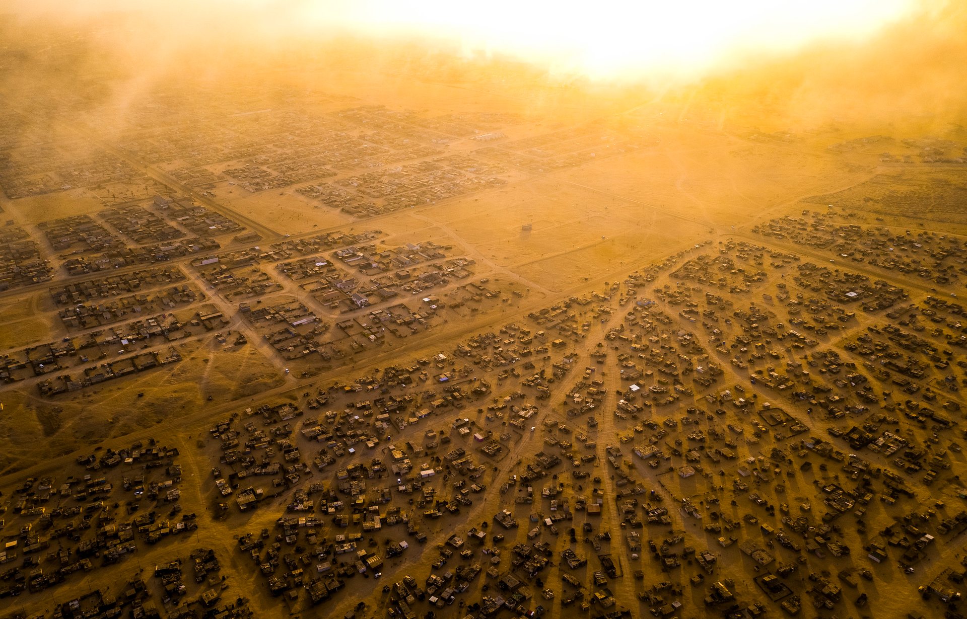 Namibia is undergoing a rapid transition from a rural society to an urban one, and informal settlements like these, on the edge of the foggy coastal city of Swakopmund, have grown fast over the past decade.