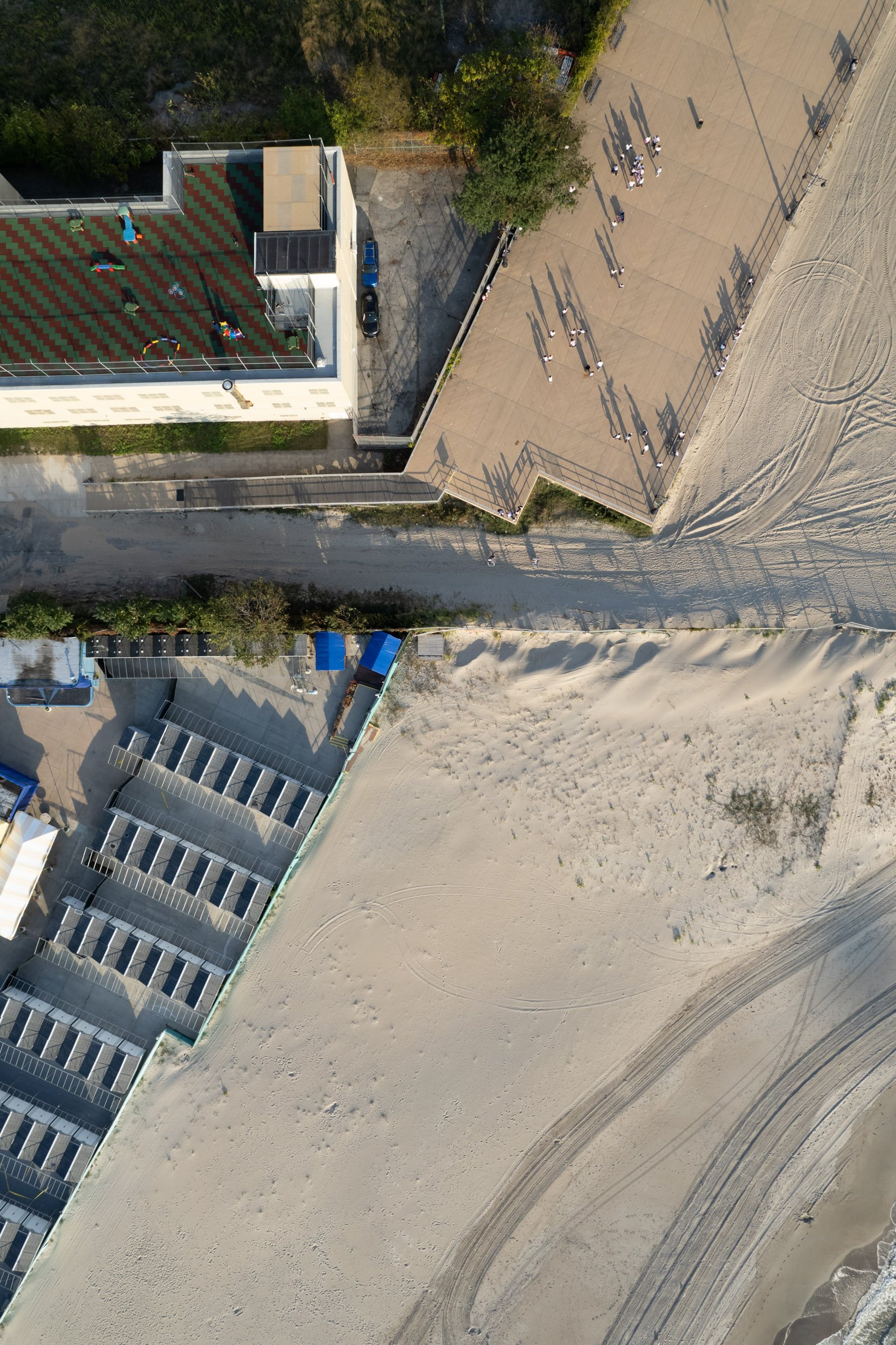 Pubic beach ends at W 37th St in Coney Island, and the private development of Sea Gate begins.