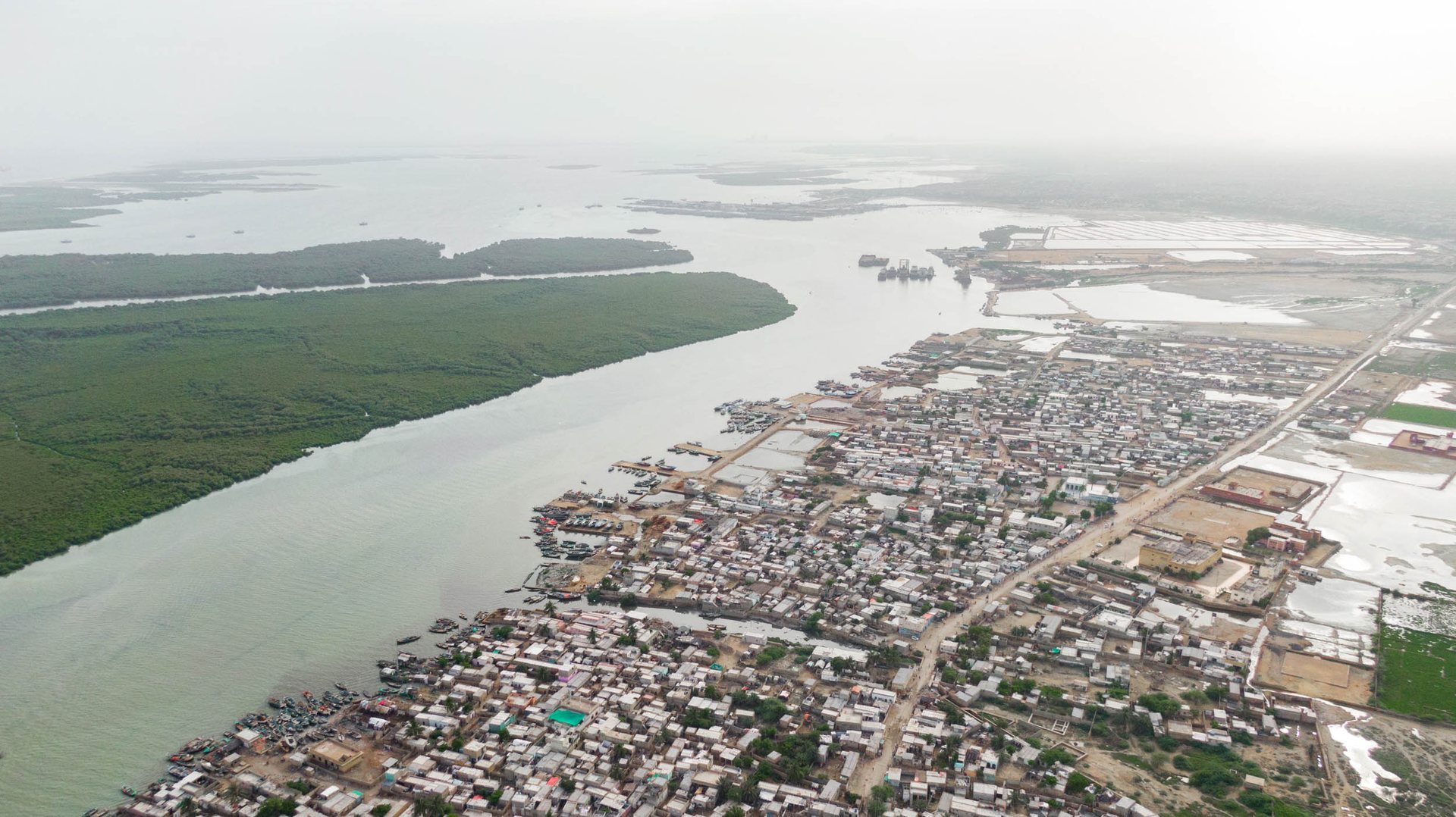 Karachi's sprawl extends to the edge of the Indus River delta, a massive biodiversity hotspot steadily being reduced by climate change and human activity along its edges.