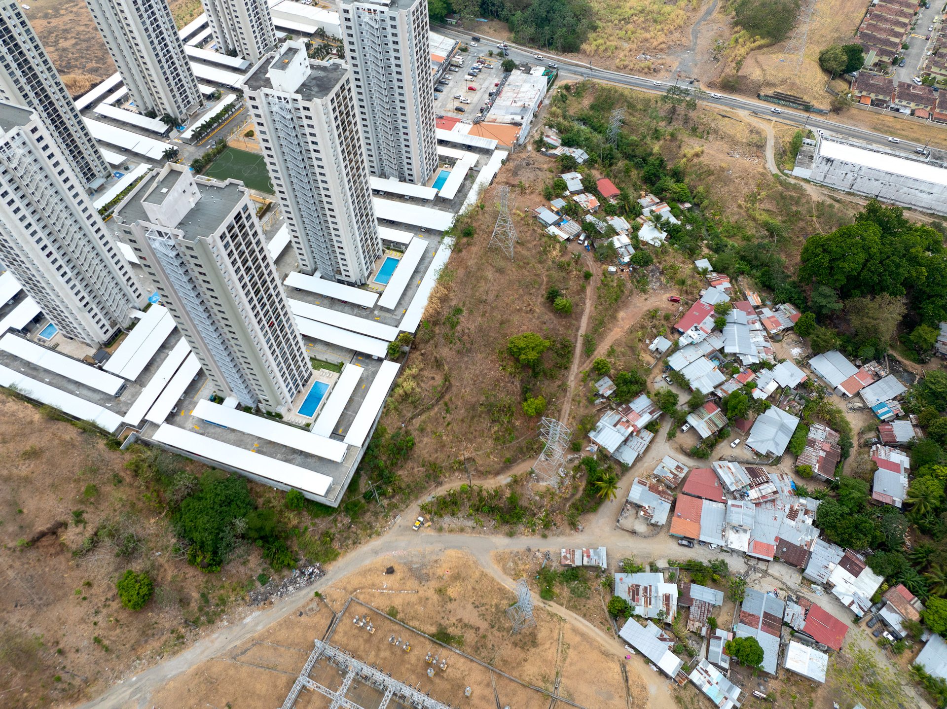 On the city's periphery, new development of identical tower blocks and informal neighborhoods exist side by side.