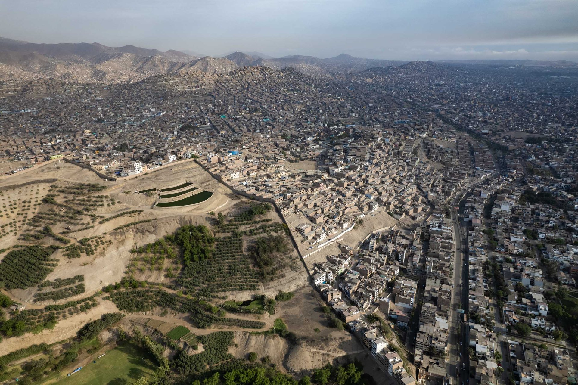 The "Wall of Shame" in Lima from a different angle, showing the vast difference in access to green space in this arid city, largely treeless city.