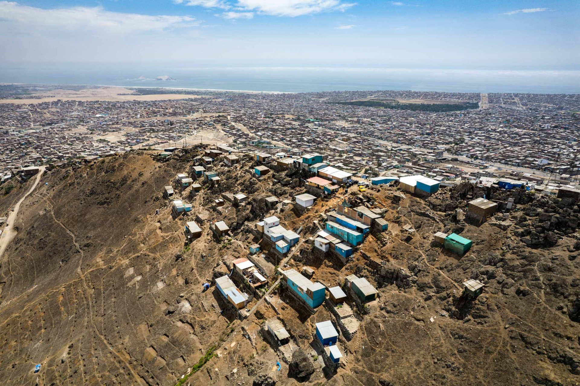 Informal housing on every hilltop - migrants from the interior of the country looking for better prospects move to Lima, many of them ending up in dusty hilltops like this in Villa Maria del Trionfo.