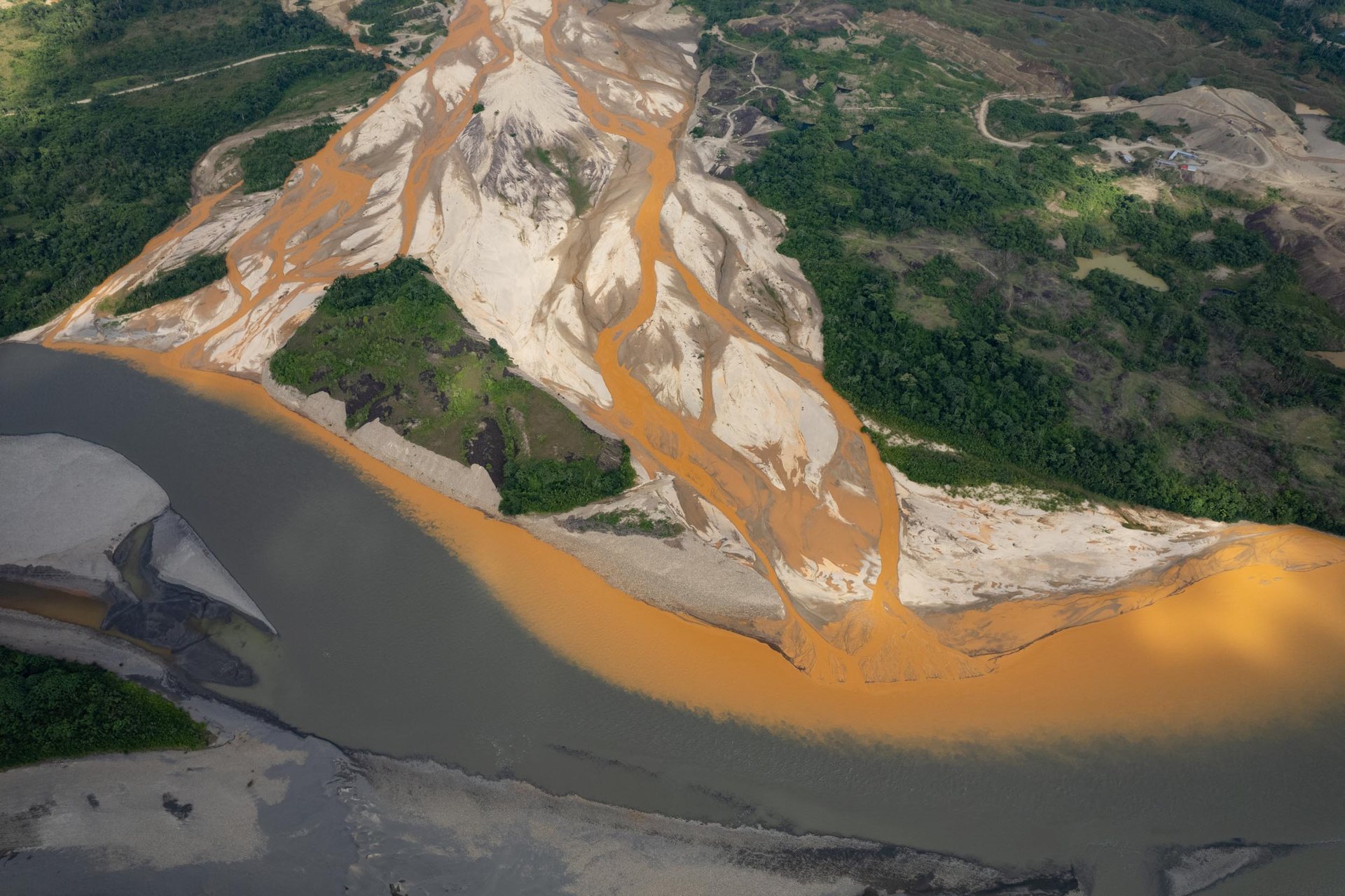 Toxic runoff from illegal gold mines into one of the tributaries of the Inambari near the town of Mazuko.