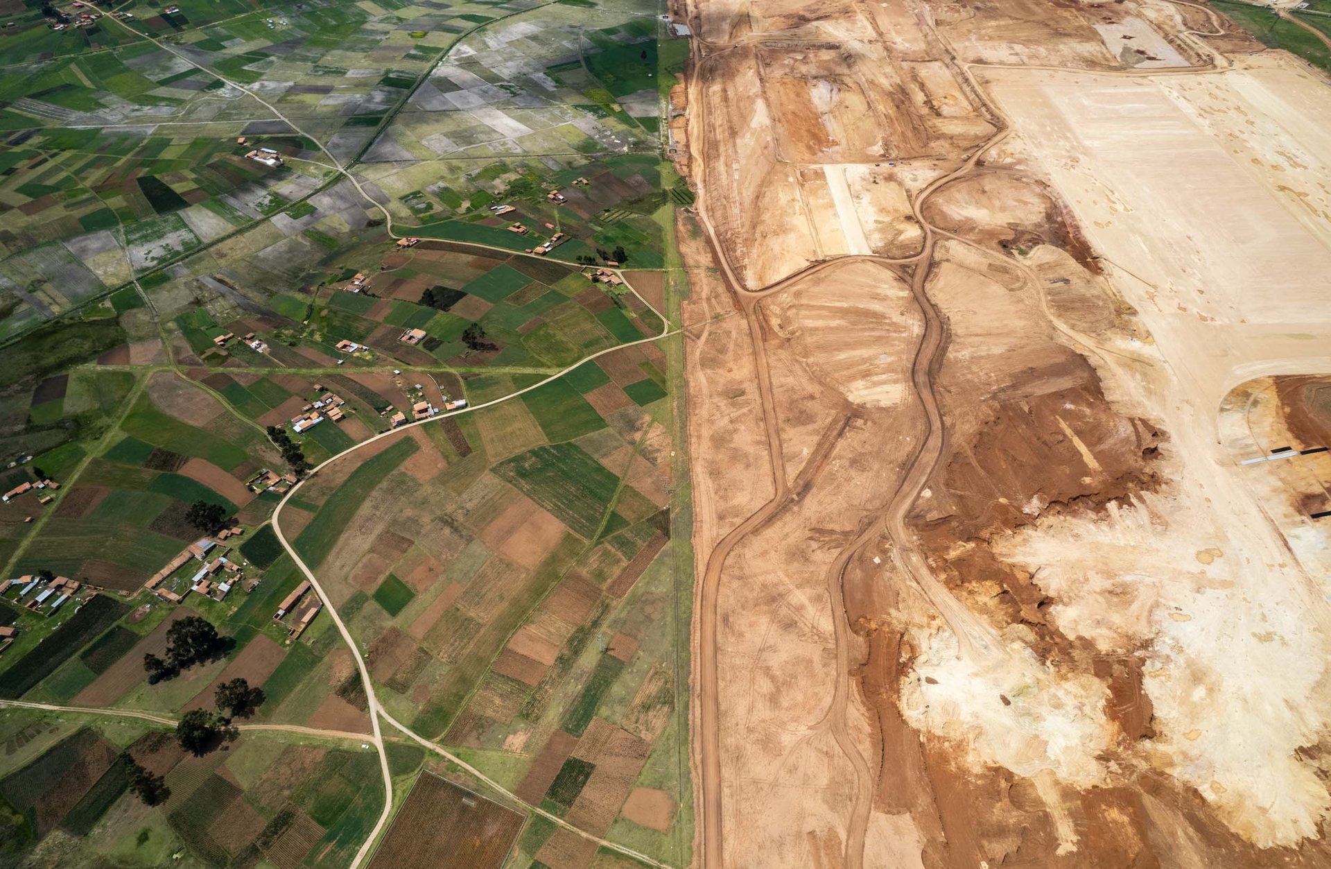 Chinchero airport construction reshapes farmland near Cusco, stirring debate over tourism impact.