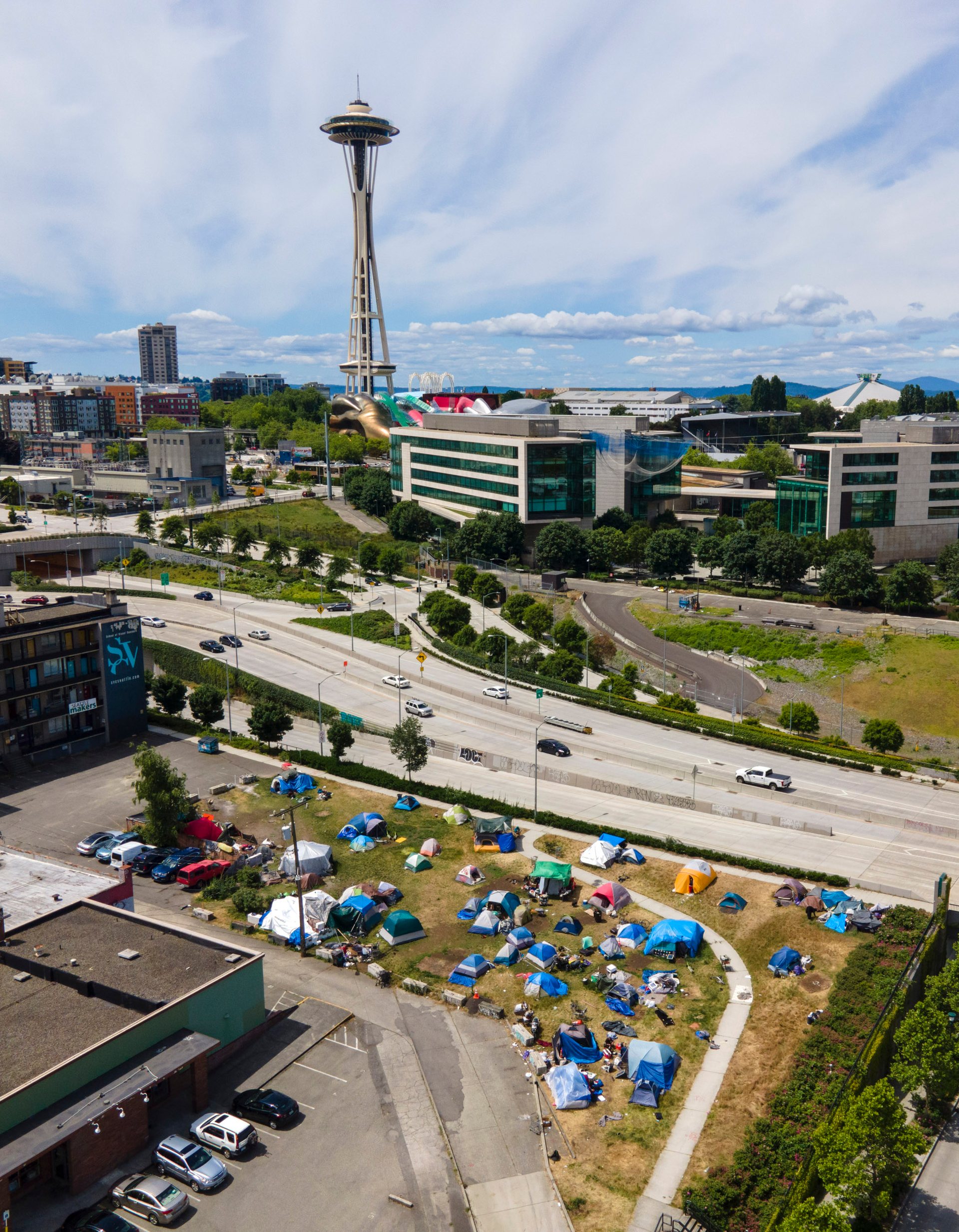 Large homeless camps dot the city, including next to Seattle's most famous monuments.