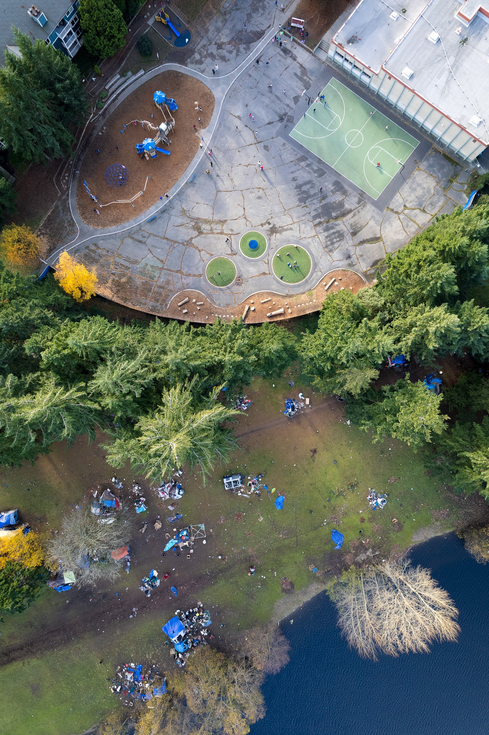 This unsanctioned grouping of tents on city-owned park land in North Seattle and next to a local school, has residents angry .