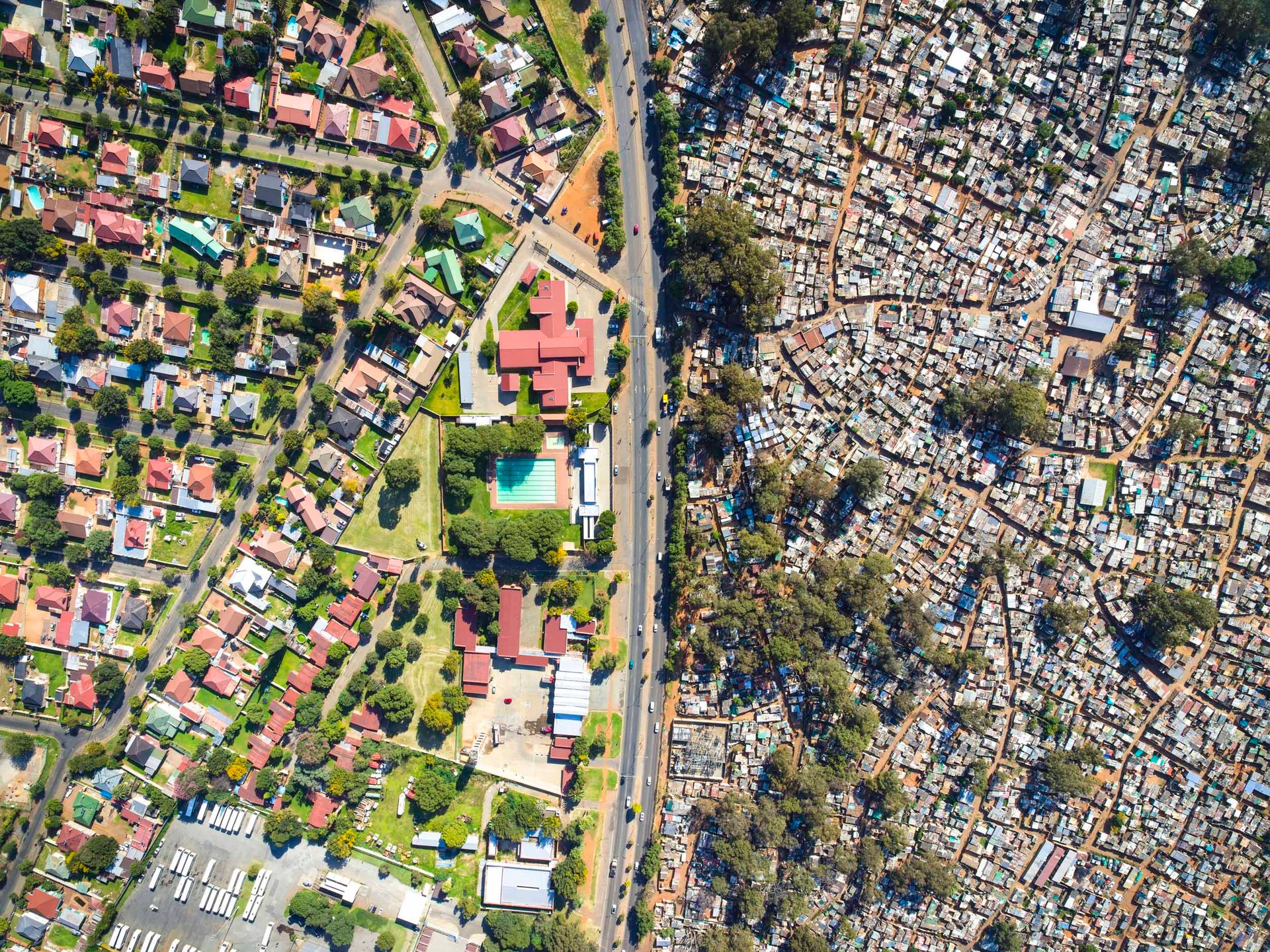 Aerial view of Primrose suburb bordering Makause informal settlement in Johannesburg, South Africa