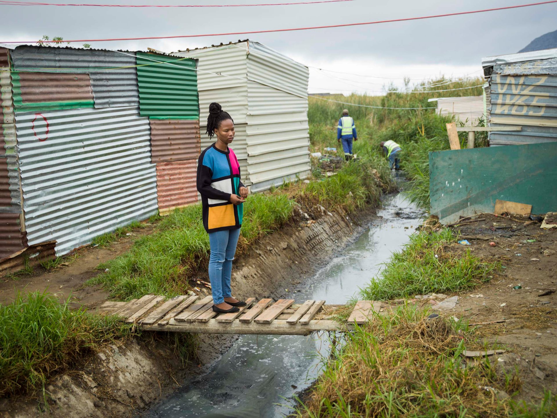 Asiphe Ntshongontshi, resident of Masiphumelele, lives in a simple shack made out of tin and wood, along with thousands of other people.