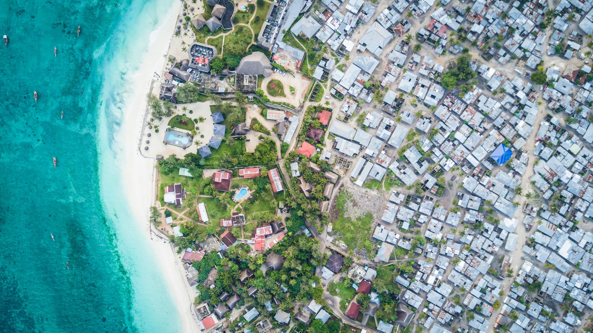 The beachfront at Nungwi, on the northern tip of Zanzibar, is lined with expensive hotels and resorts catering to wealthy foreign visitors, some charging thousands of dollars a night.
