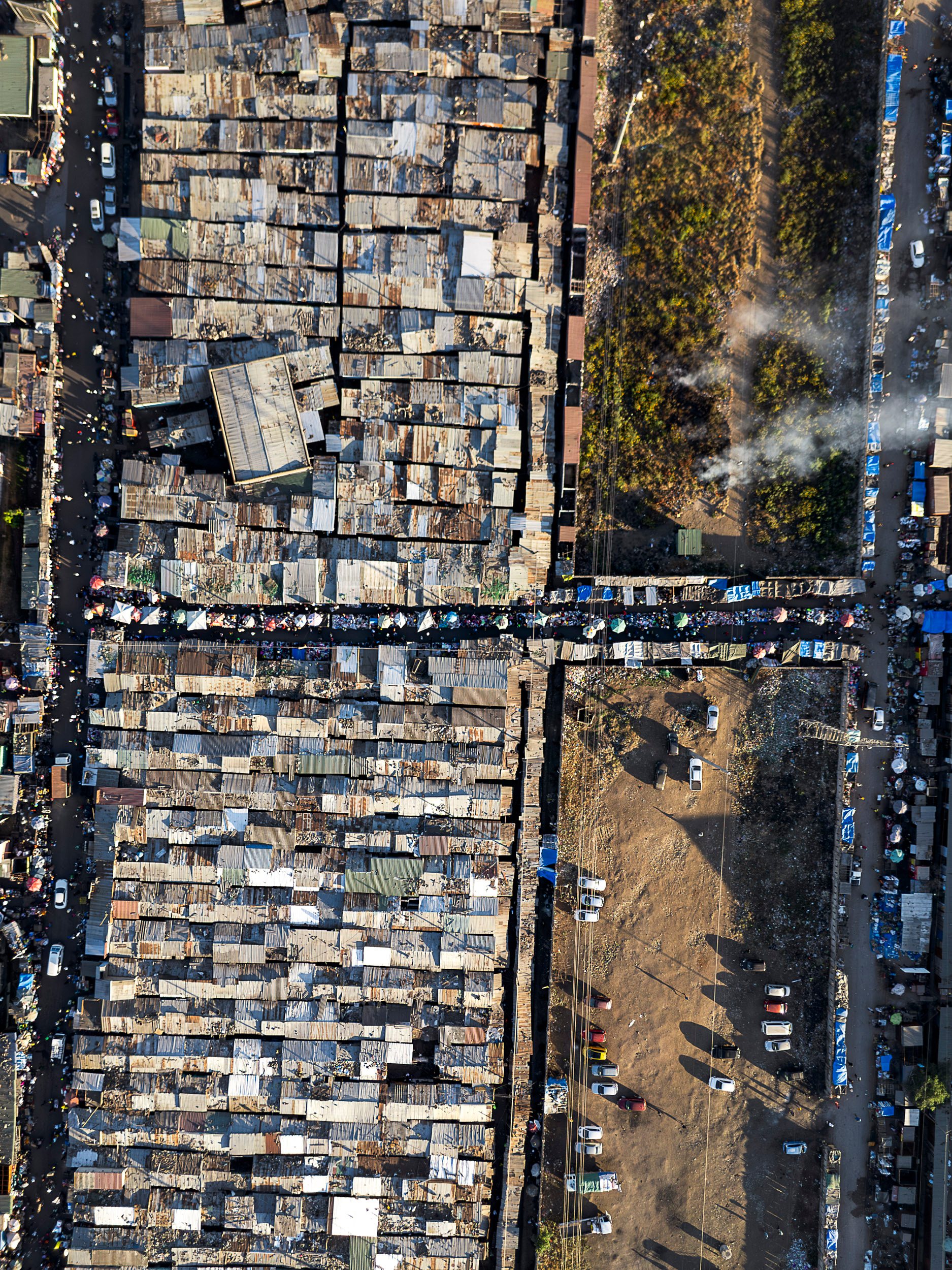 In markets like these in central Lusaka, thousands of traders pay a daily council levy plus a patchwork of unofficial fees collected by party cadres for the use of toilets, walkways, and the privilege of staying put .